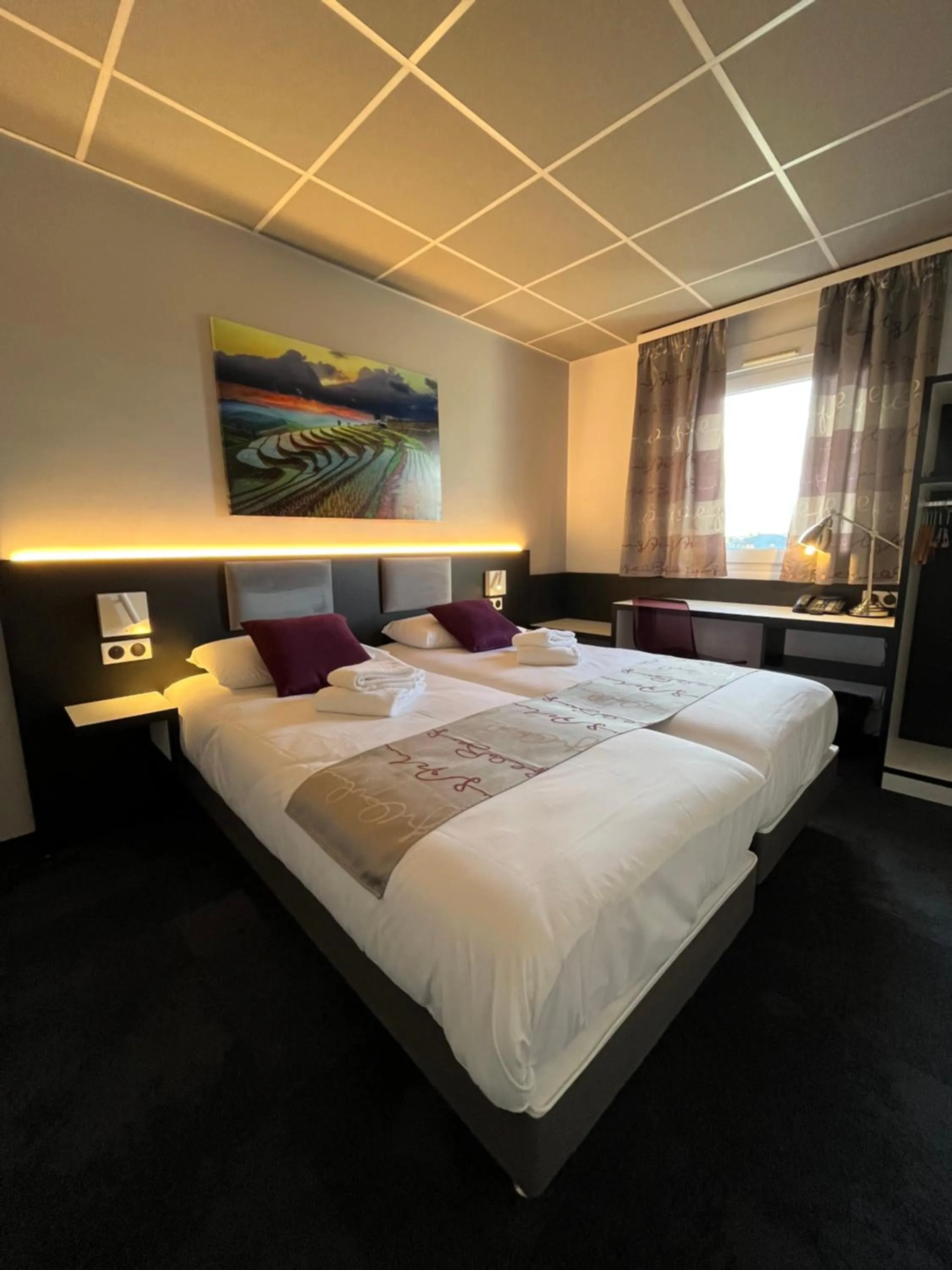 Photo of the whole room, Bed in BRIT HOTEL LE VESOUL