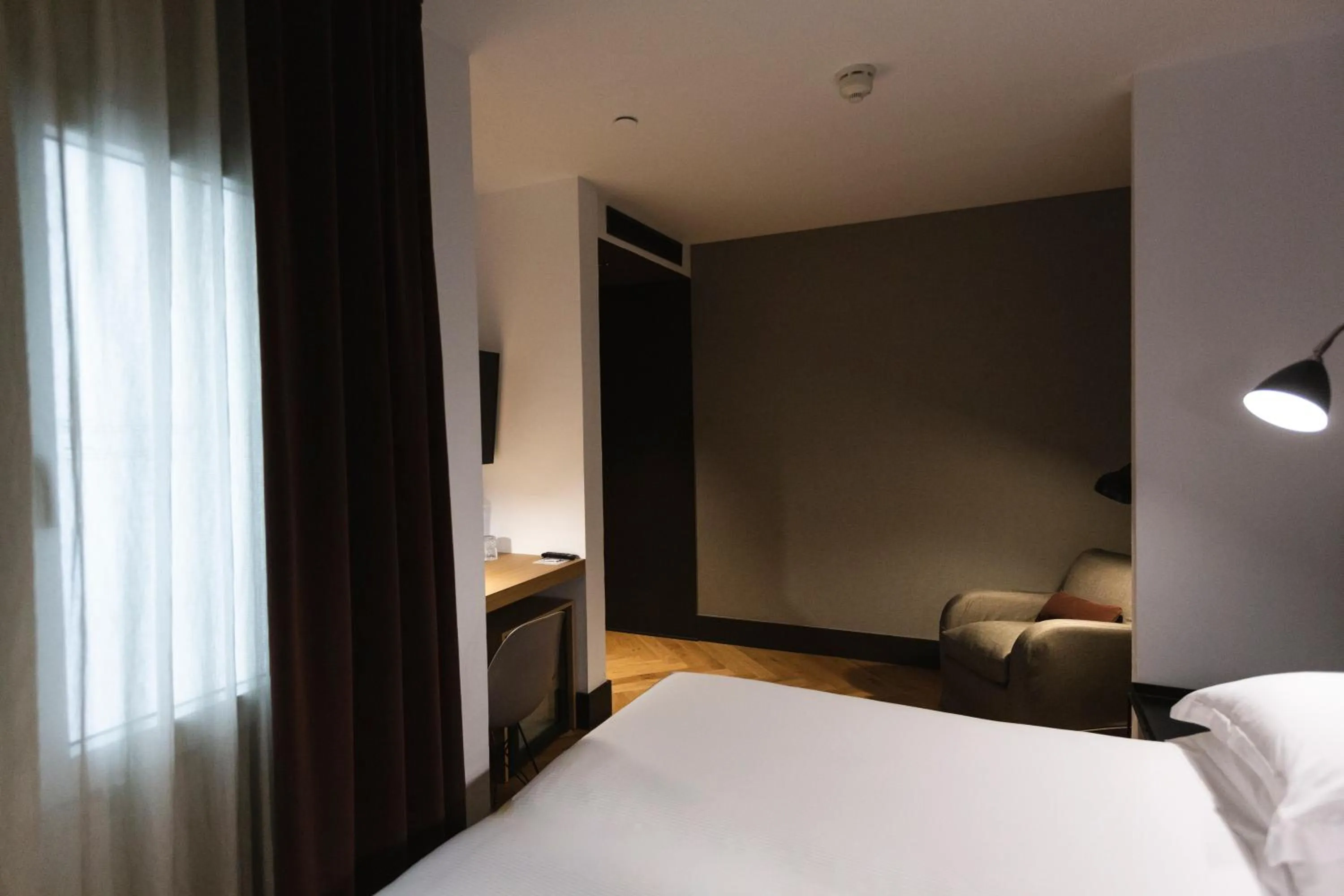 Bed in Alexandra Barcelona Hotel, Curio Collection by Hilton