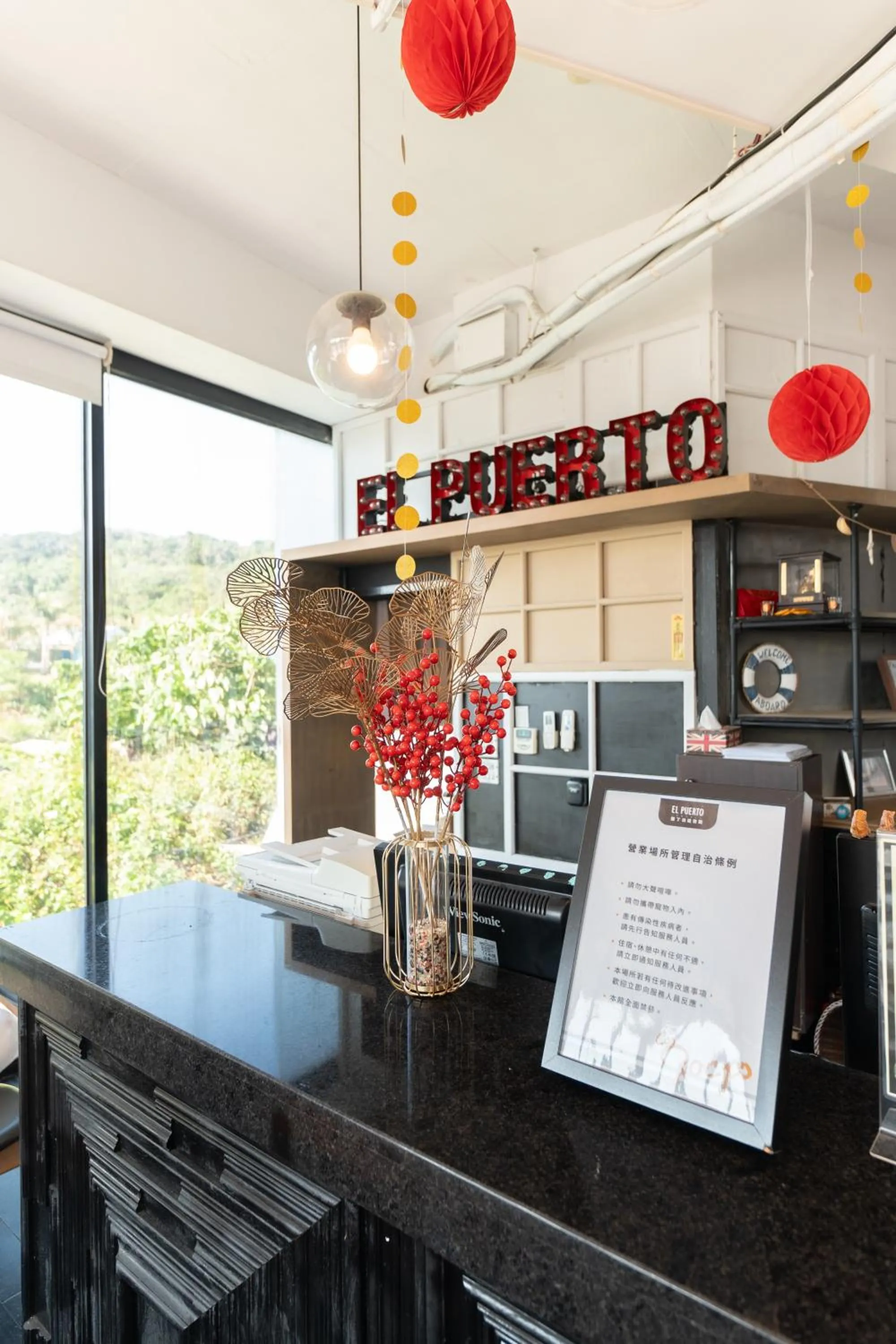 Property logo or sign in El Puerto Hotel