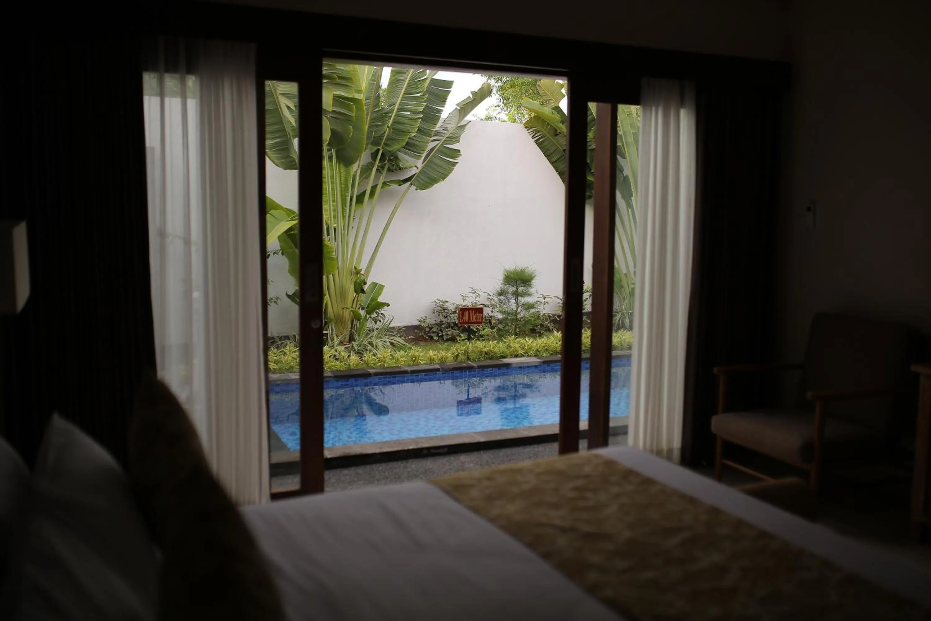 View (from property/room), Bed in Kubu Garden Suites & Villas Nusa Dua