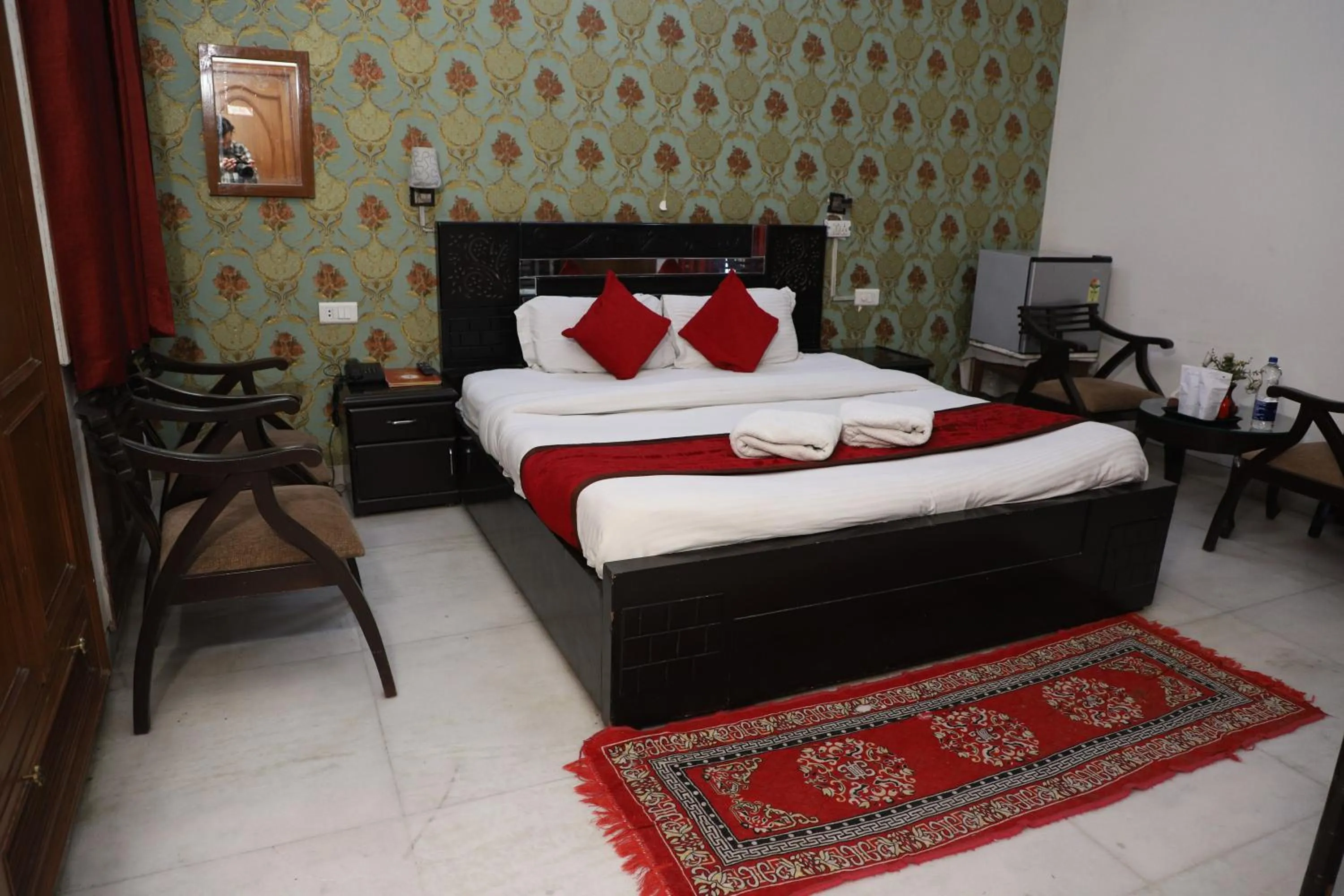 Bed in Hotel Ashray Noida