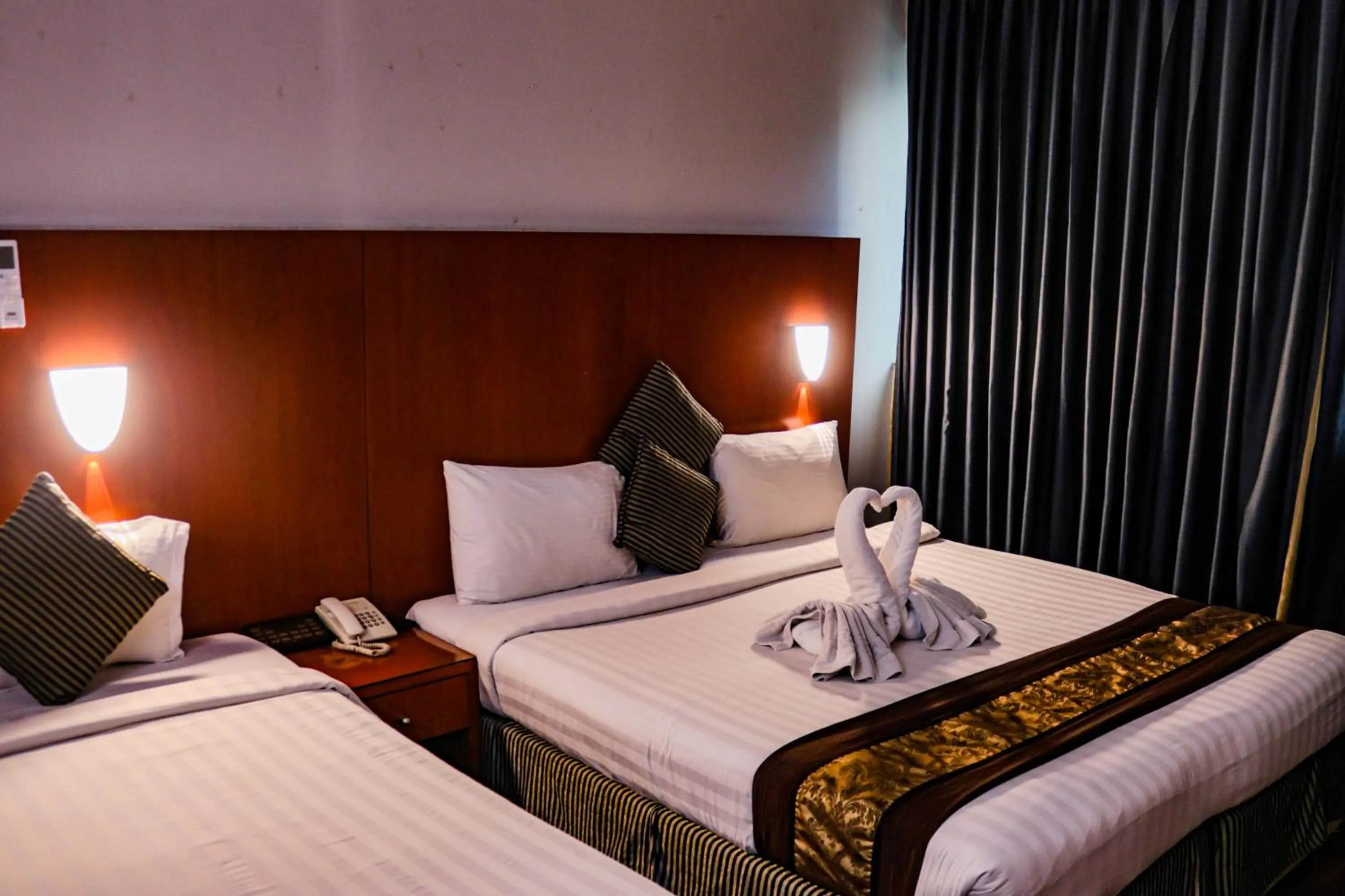 Bed in BOONMAX Hotel