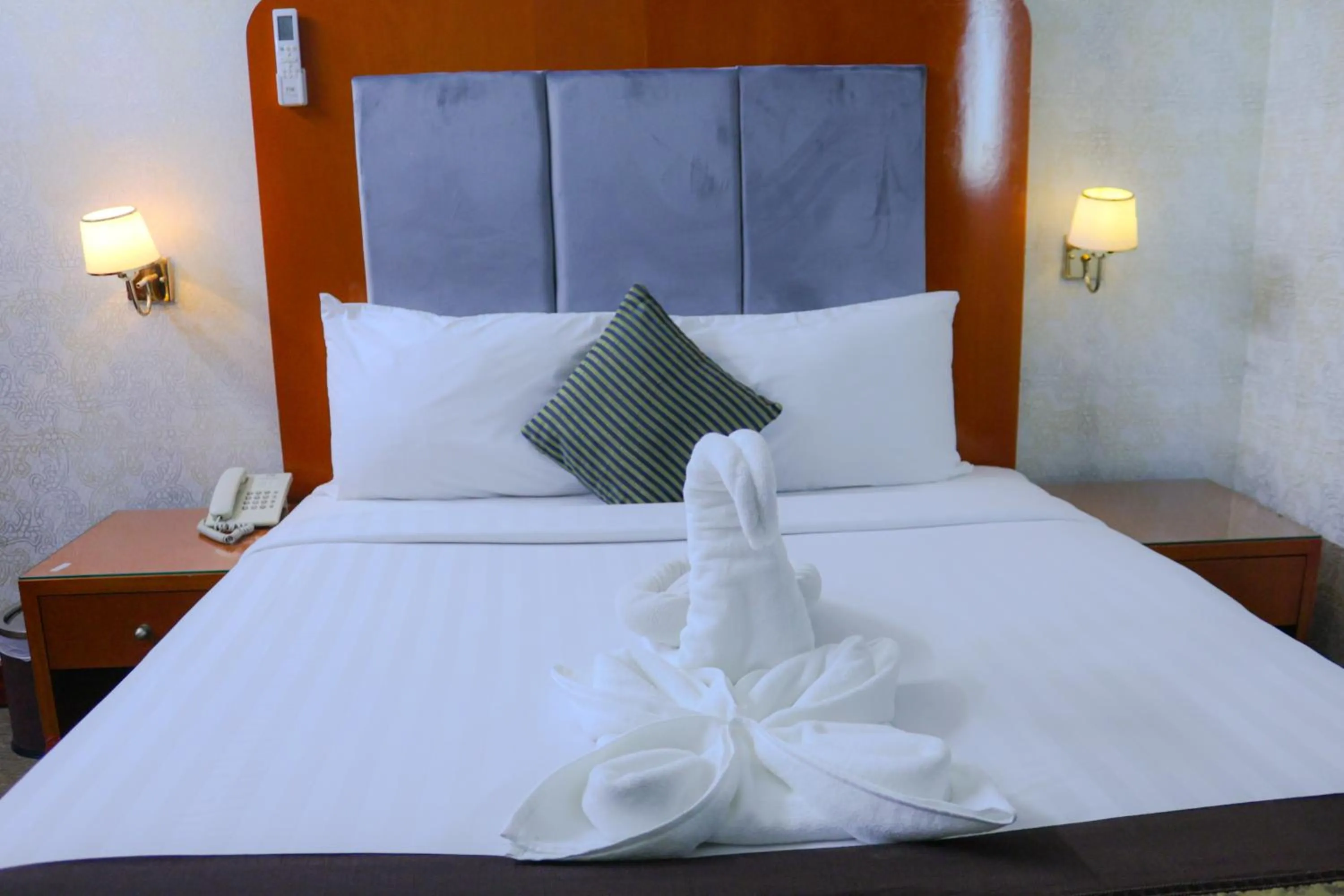 Bed in BOONMAX Hotel