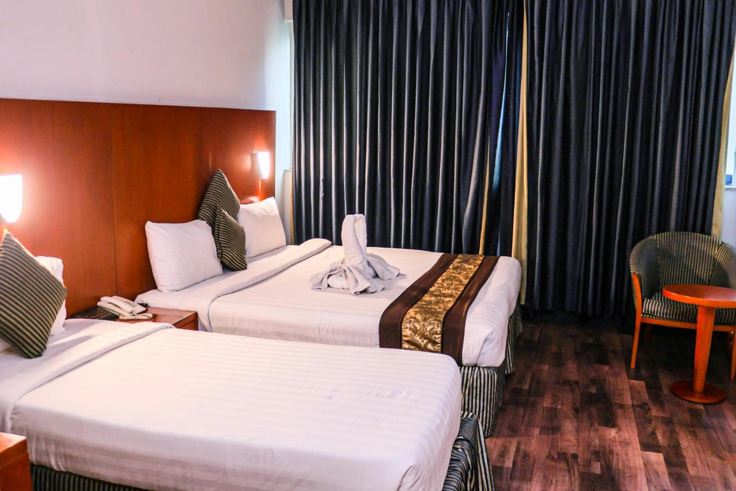 Bed in BOONMAX Hotel