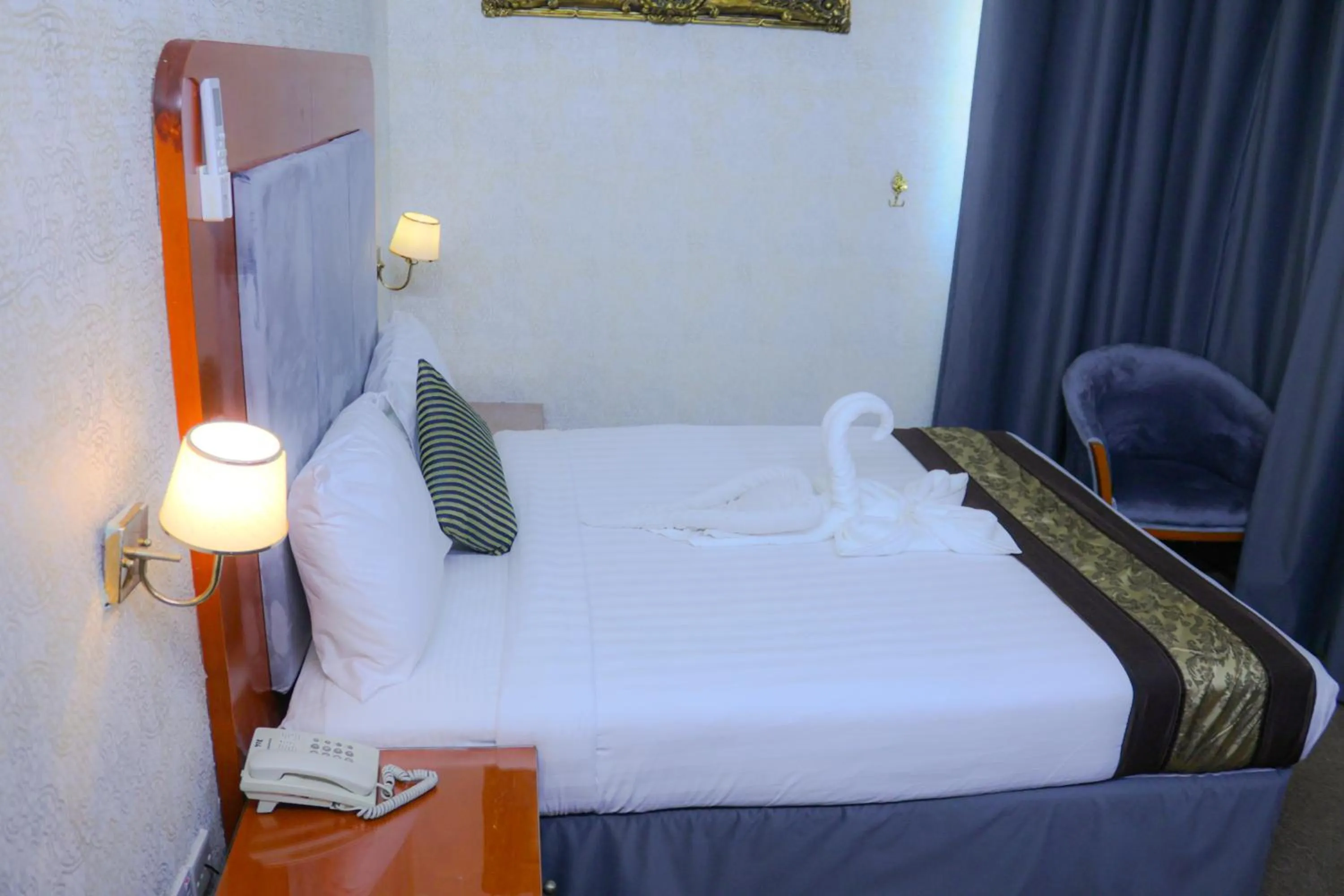 Photo of the whole room, Bed in BOONMAX Hotel