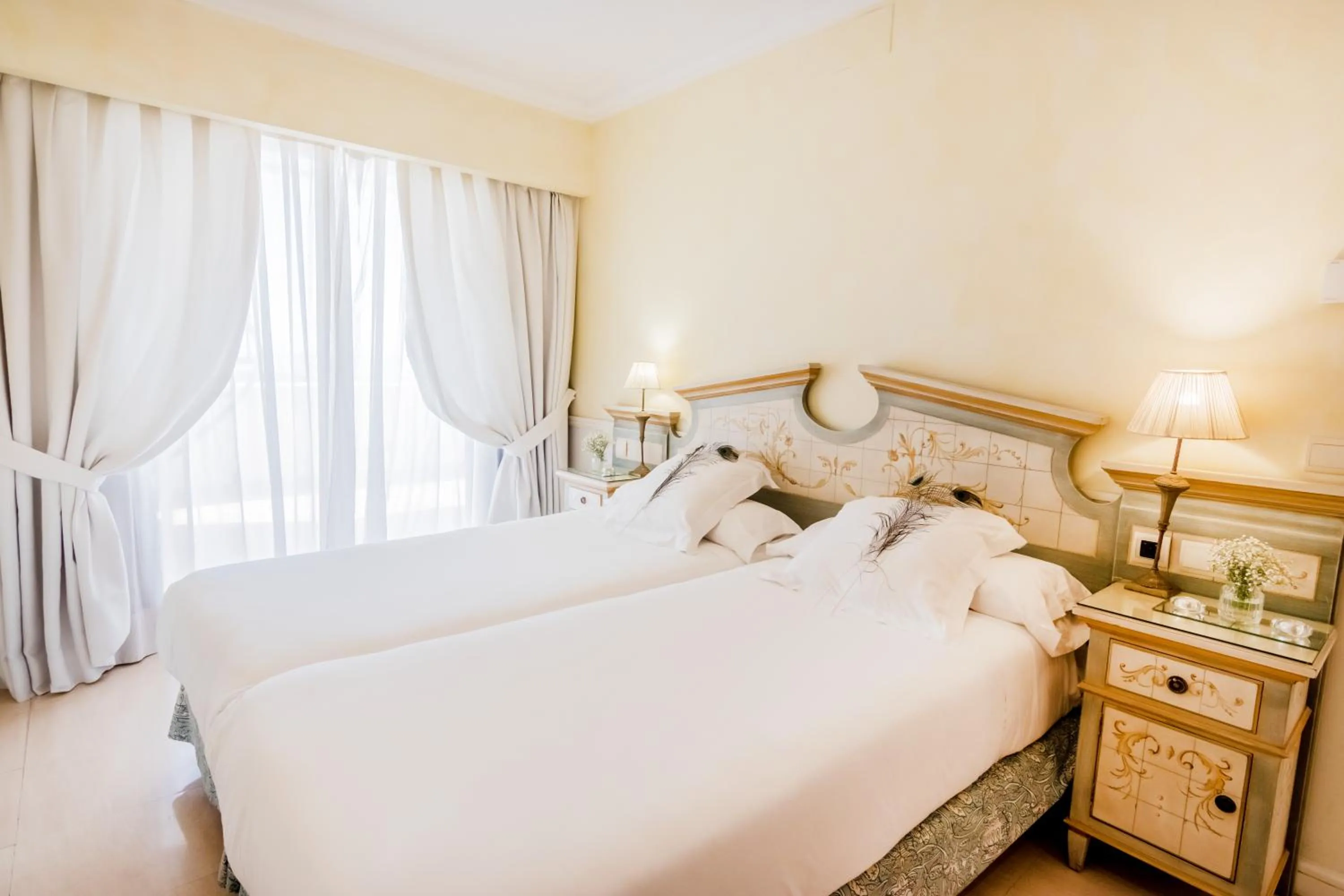 Bed in Guadalpin Suites