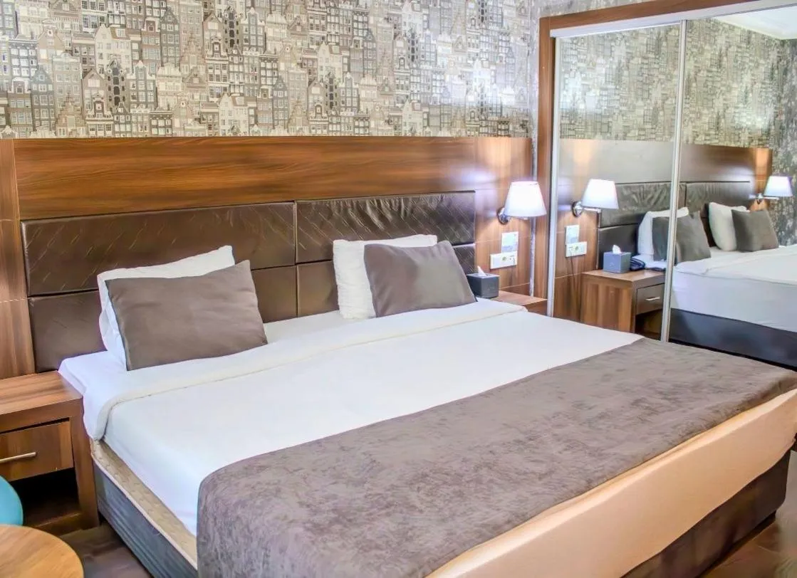 Bed in Ma City Hotel