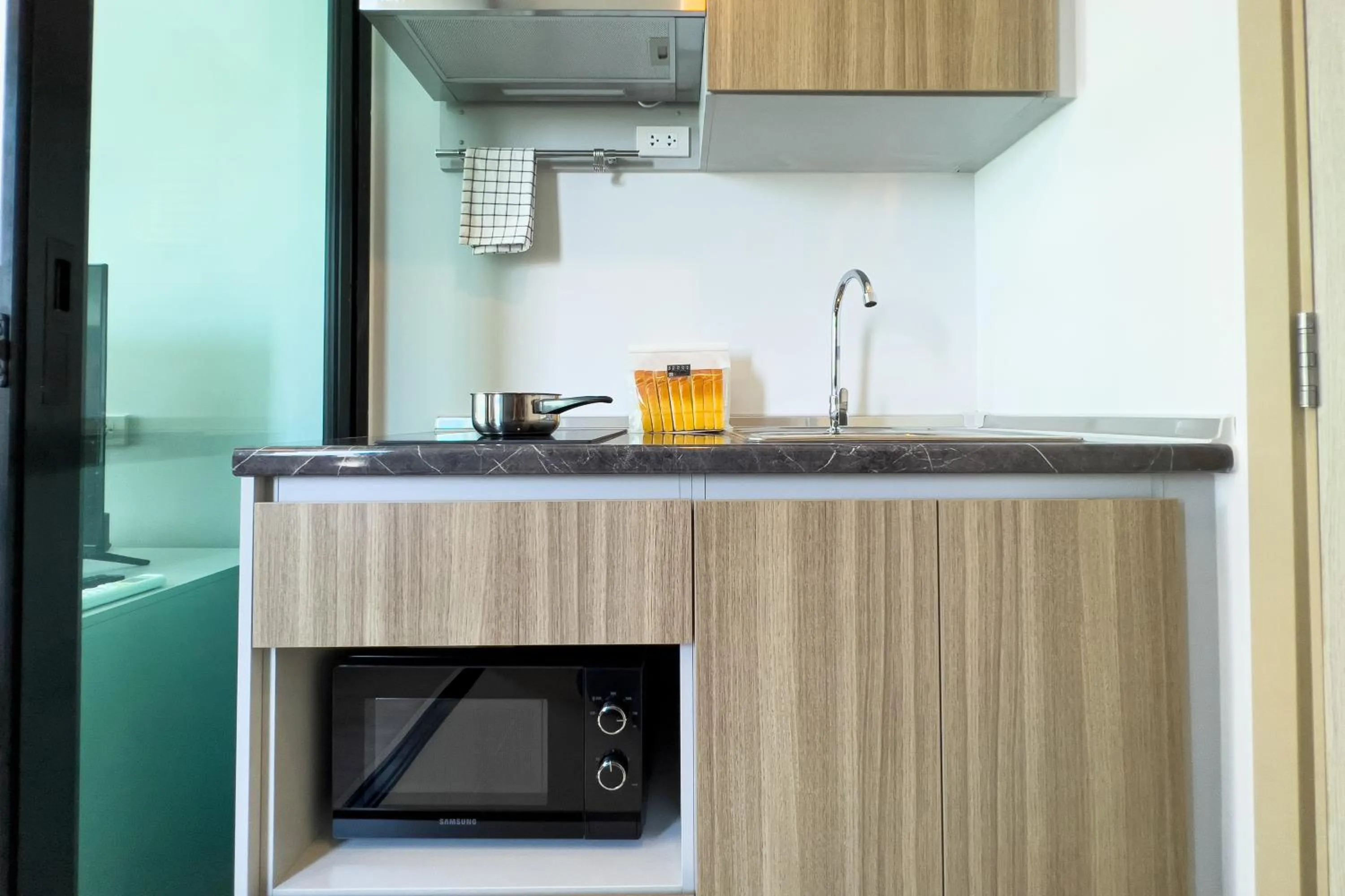 Kitchen or kitchenette in Wellness Stay & Hotel Sukhumvit 107