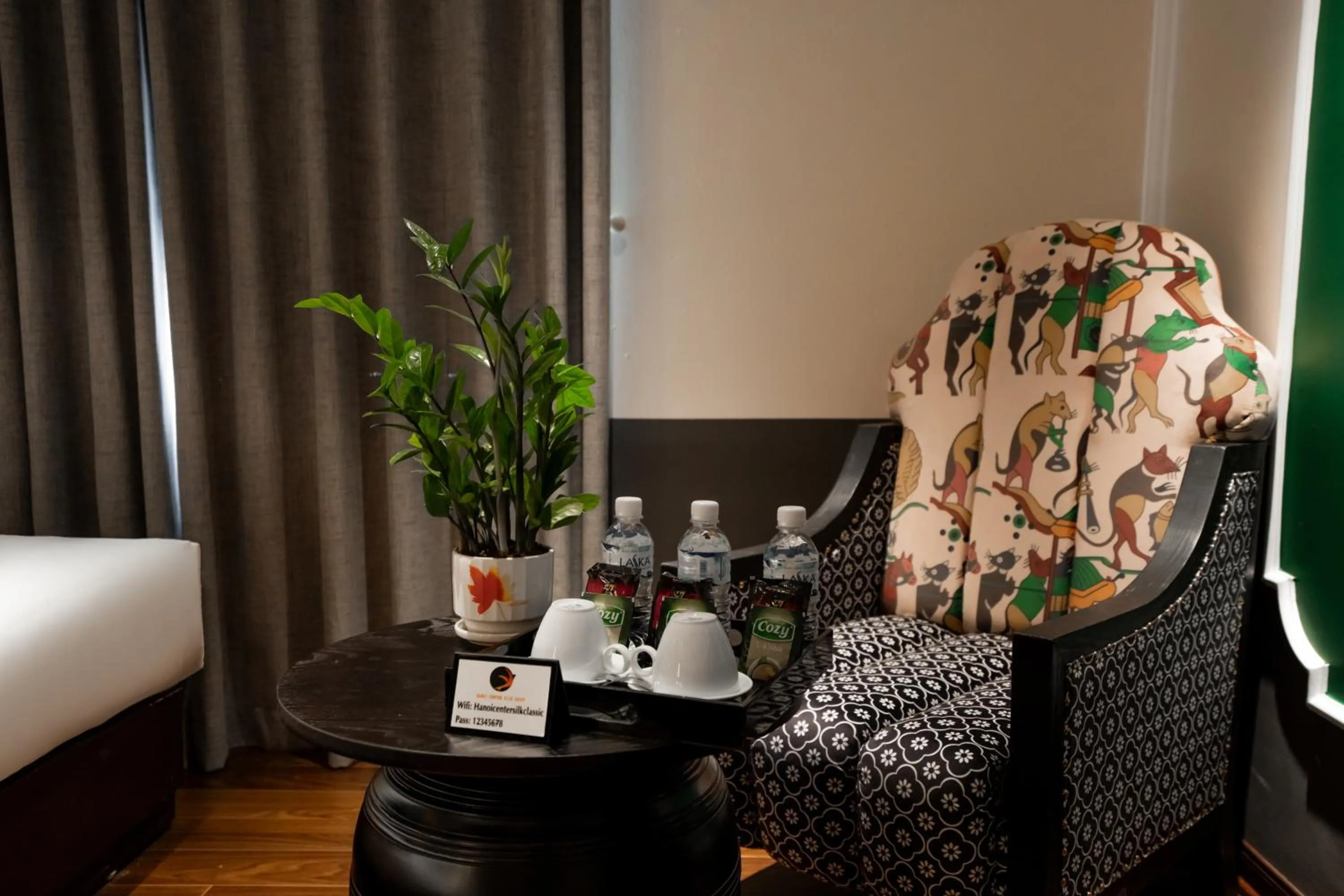 Seating area, Bed in Hanoi Center Silk Classic Hotel & Travel