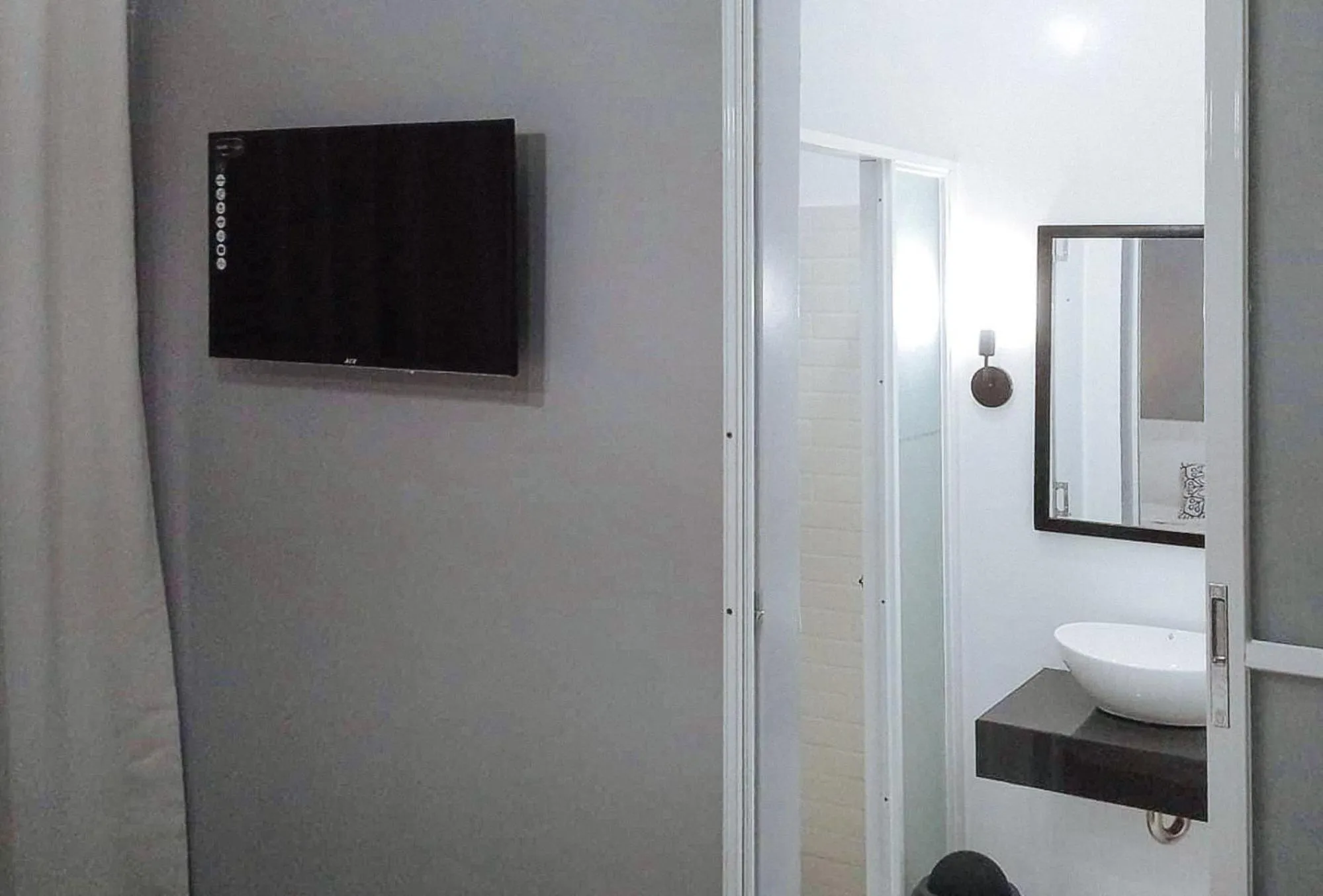 TV and multimedia, Bed in Angels Bed and Breakfast Sipalay City by RedDoorz