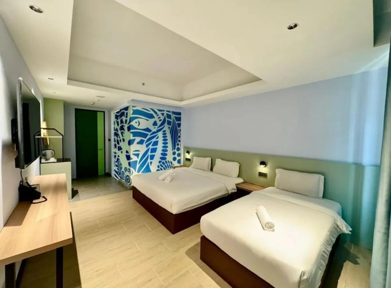 Bed in Wing Tat Grand Hotel