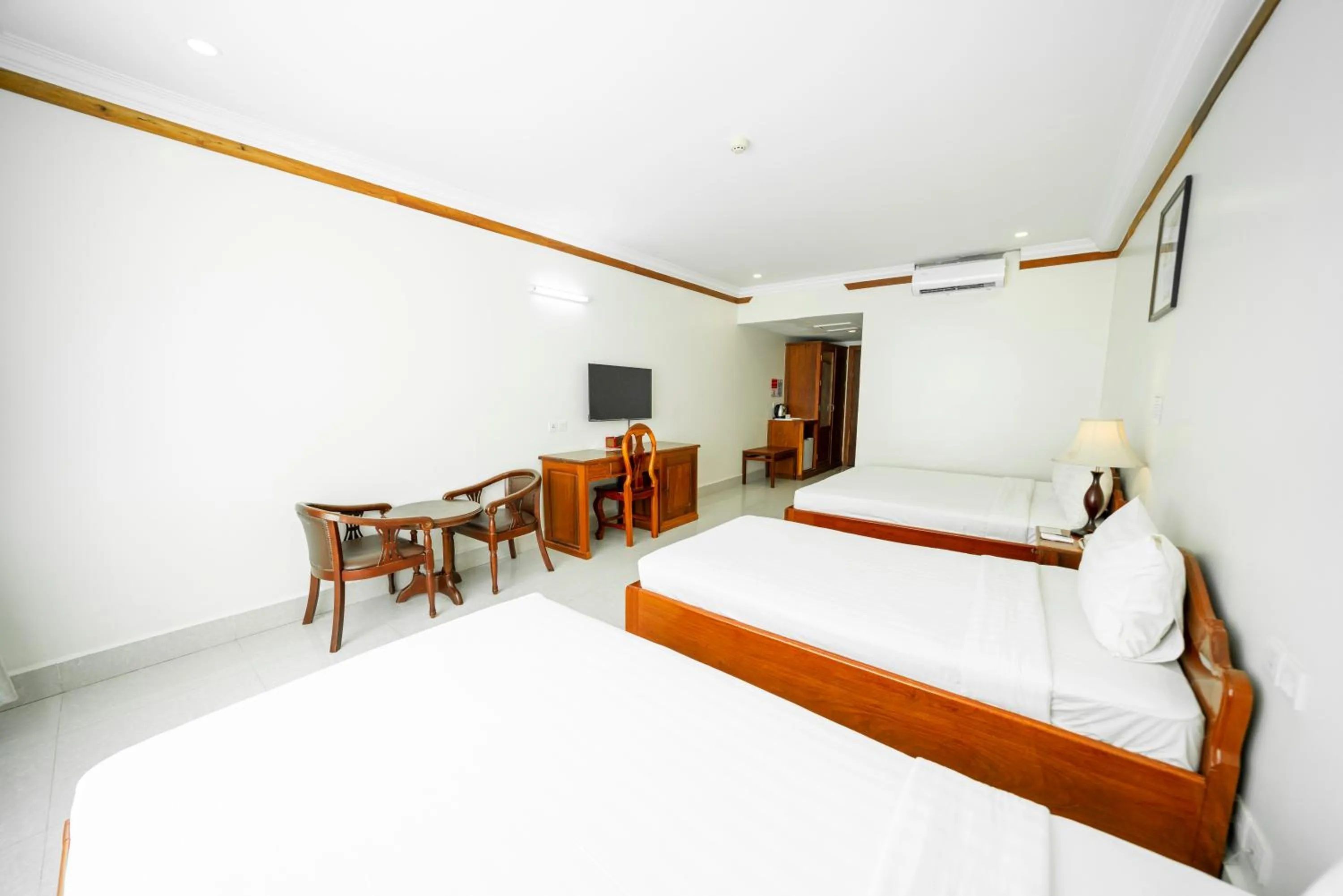 Communal lounge/ TV room, Bed in Pursat Riverside Hotel & Spa