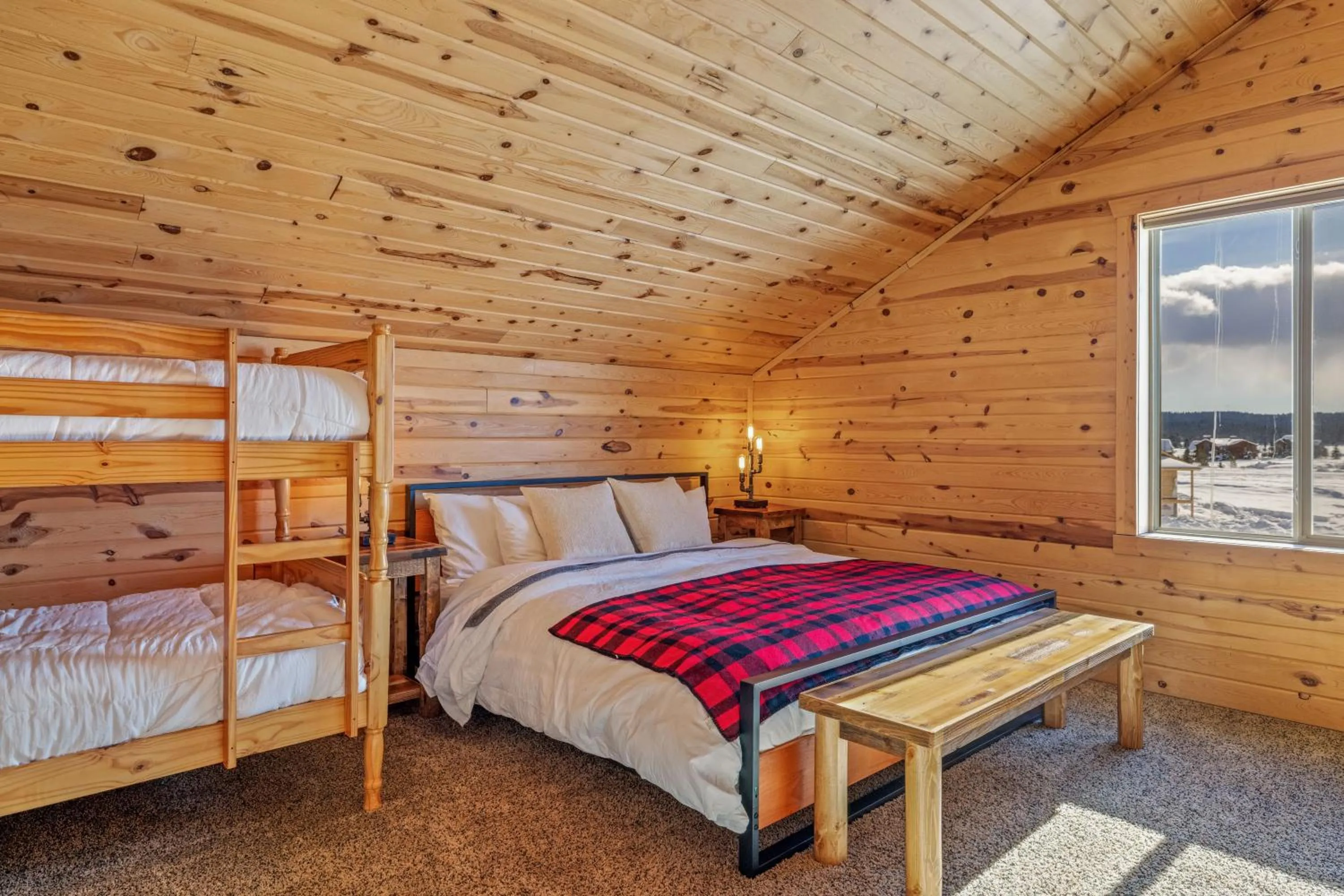 Bed in Liberty Lodge by KABINO Hot Tub Air Hockey 3 Living Rooms 7 bedrooms Boat Launch Reservoir ATV Snowmobile Trails WiFi