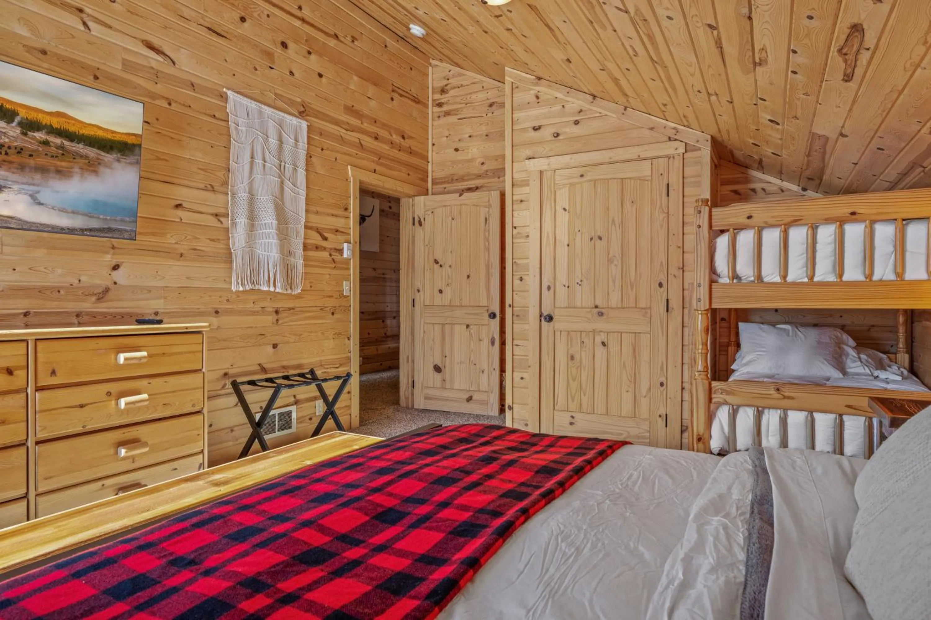 Bed in Liberty Lodge by KABINO Hot Tub Air Hockey 3 Living Rooms 7 bedrooms Boat Launch Reservoir ATV Snowmobile Trails WiFi