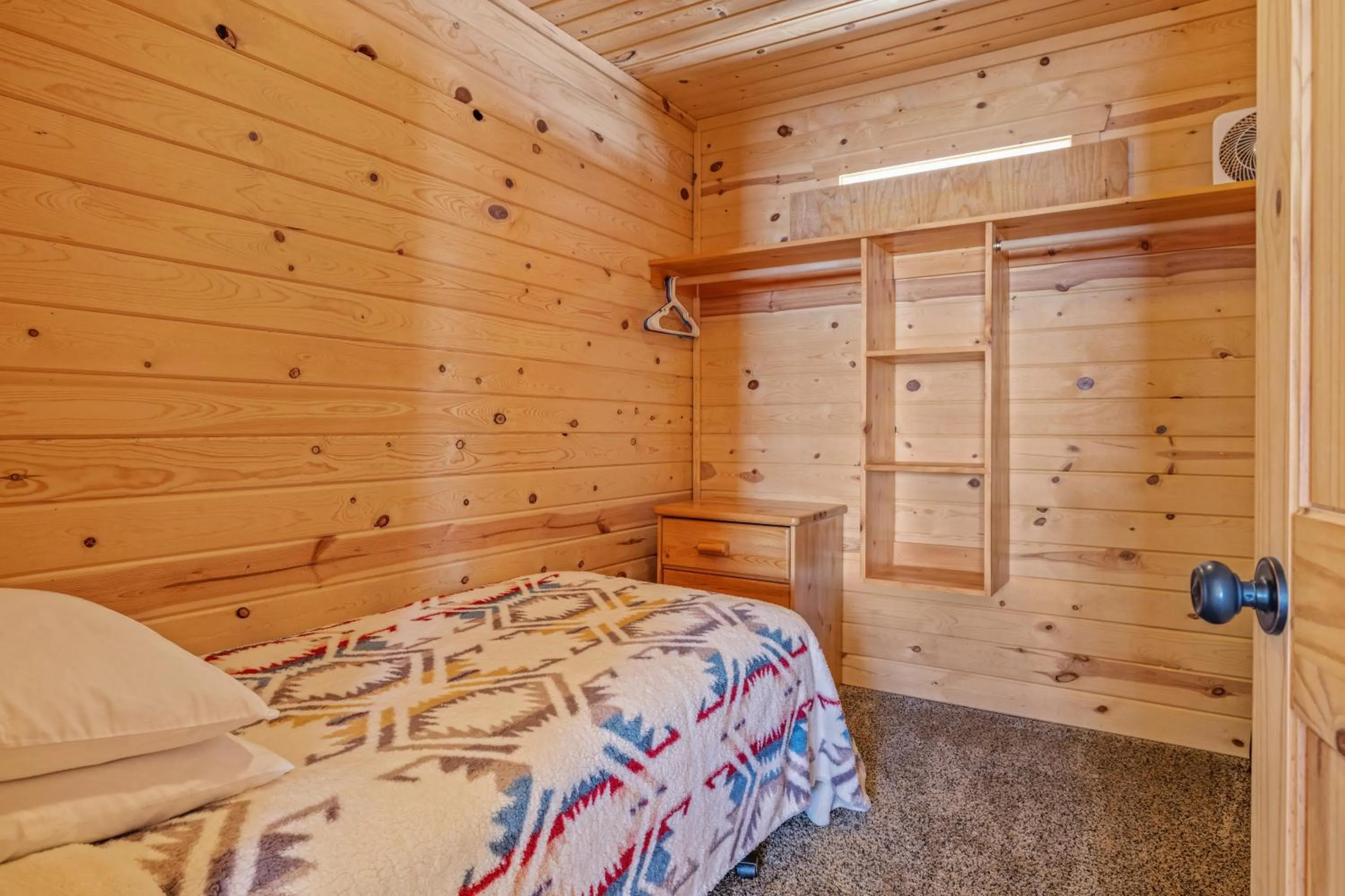 Bed in Liberty Lodge by KABINO Hot Tub Air Hockey 3 Living Rooms 7 bedrooms Boat Launch Reservoir ATV Snowmobile Trails WiFi