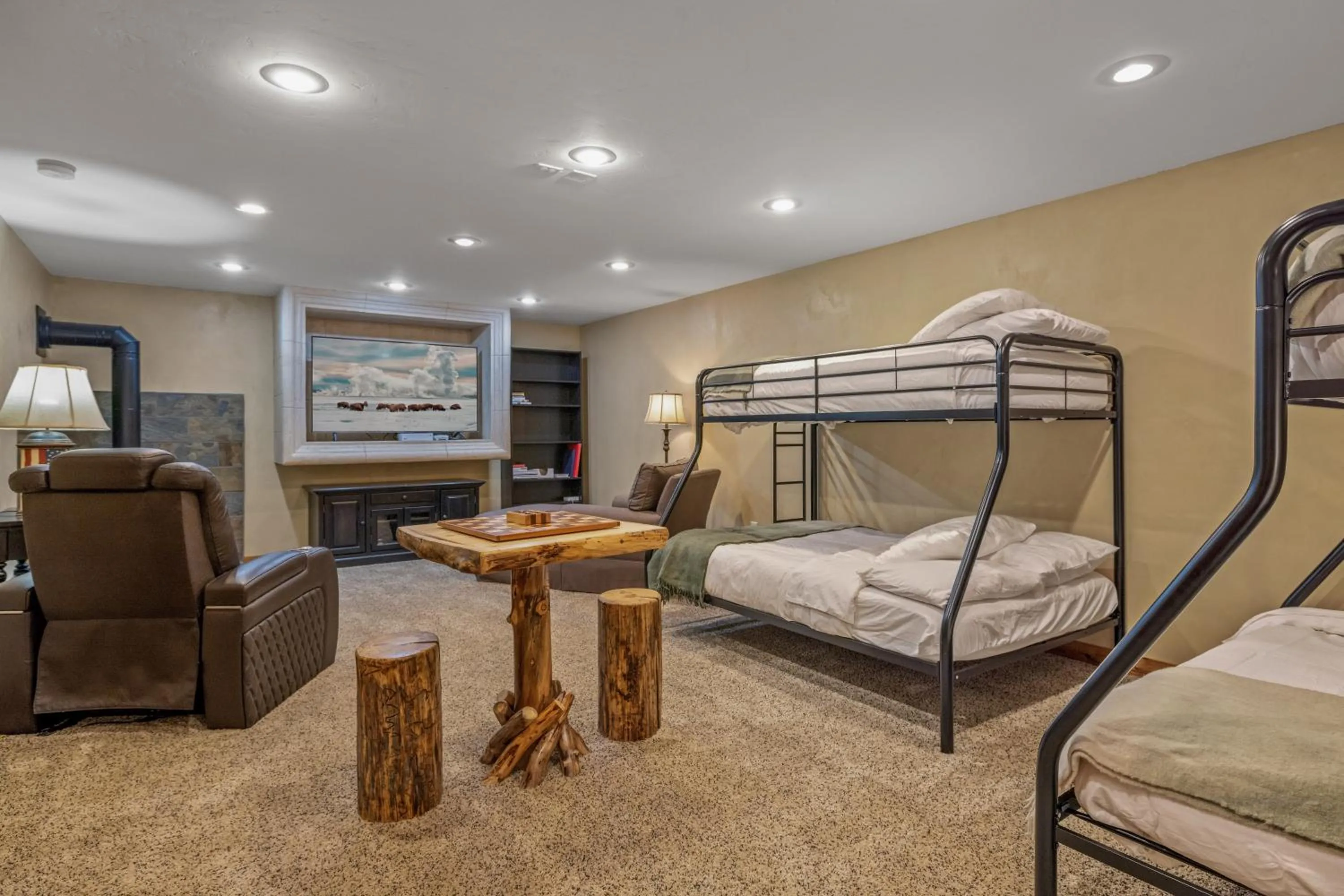Bed in Liberty Lodge by KABINO Hot Tub Air Hockey 3 Living Rooms 7 bedrooms Boat Launch Reservoir ATV Snowmobile Trails WiFi