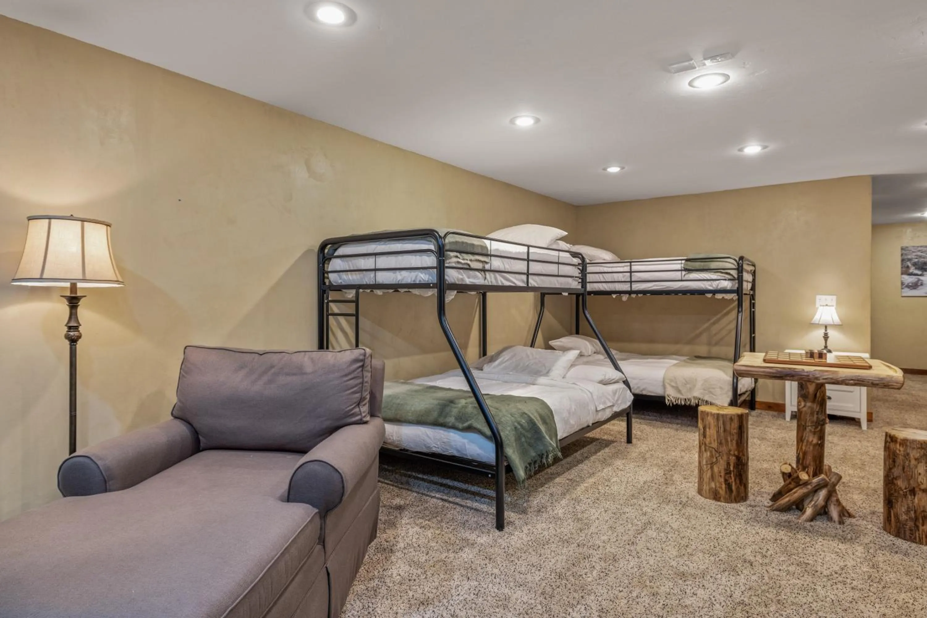 Bed in Liberty Lodge by KABINO Hot Tub Air Hockey 3 Living Rooms 7 bedrooms Boat Launch Reservoir ATV Snowmobile Trails WiFi