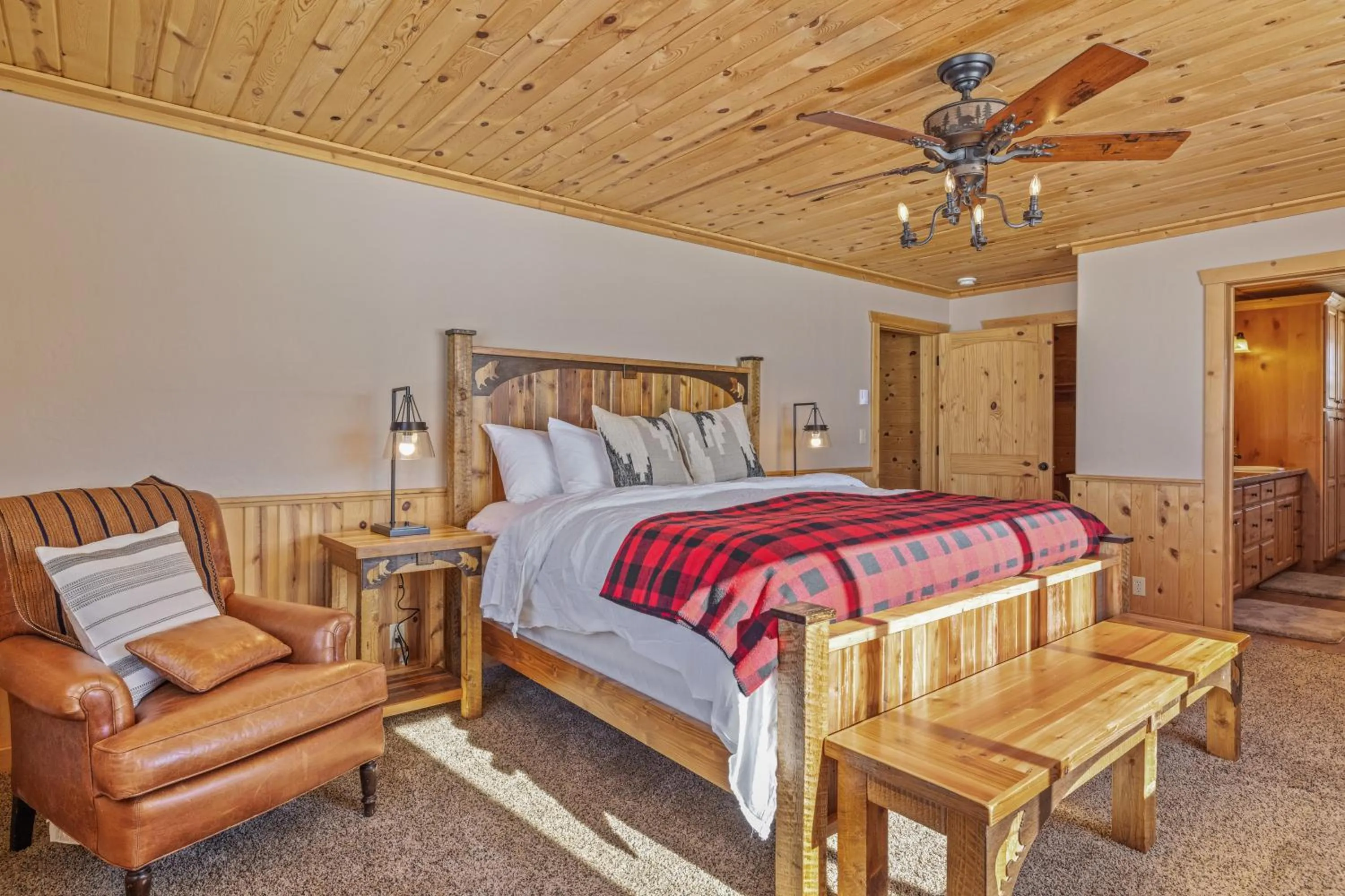 Bed in Liberty Lodge by KABINO Hot Tub Air Hockey 3 Living Rooms 7 bedrooms Boat Launch Reservoir ATV Snowmobile Trails WiFi