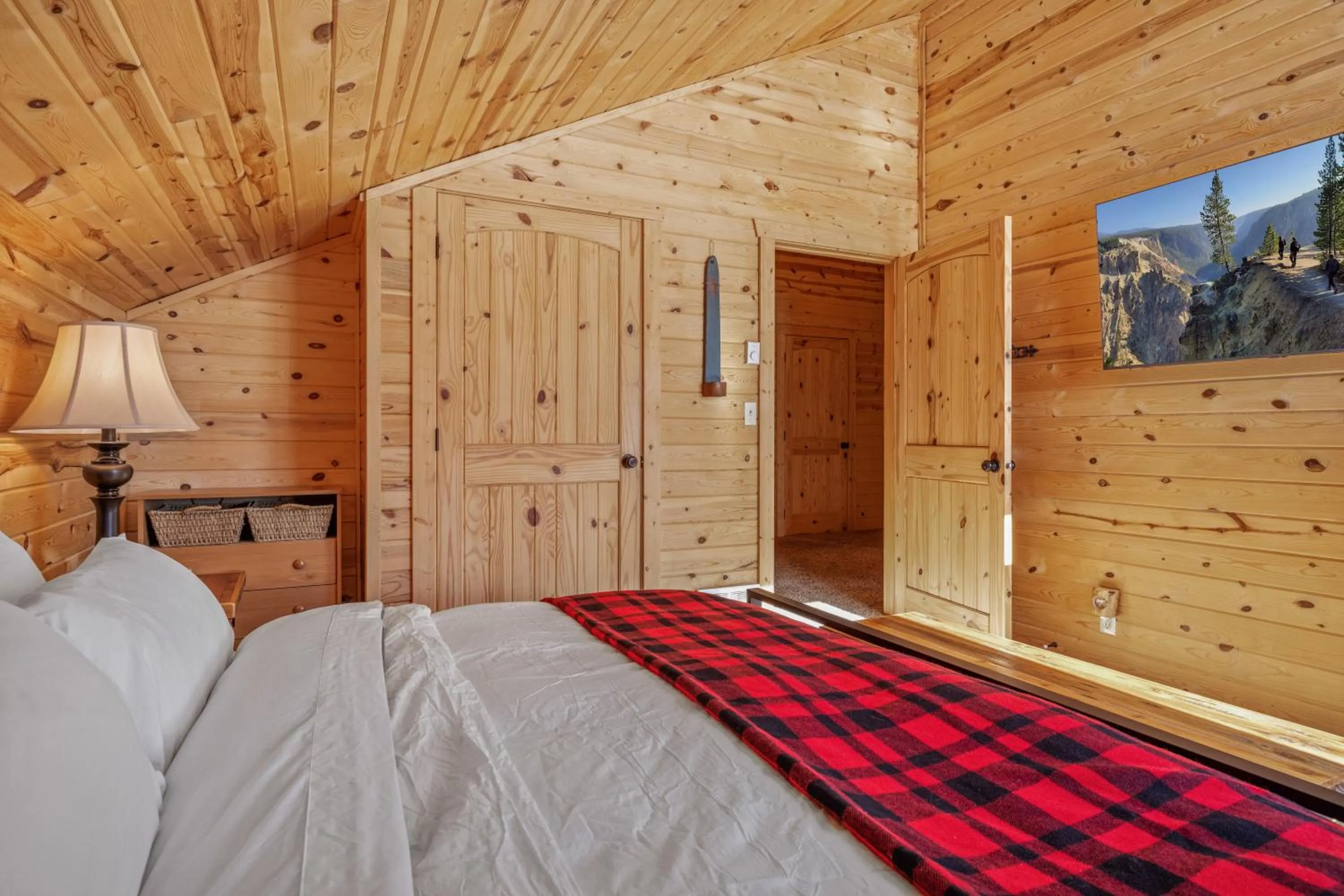 Bed in Liberty Lodge by KABINO Hot Tub Air Hockey 3 Living Rooms 7 bedrooms Boat Launch Reservoir ATV Snowmobile Trails WiFi