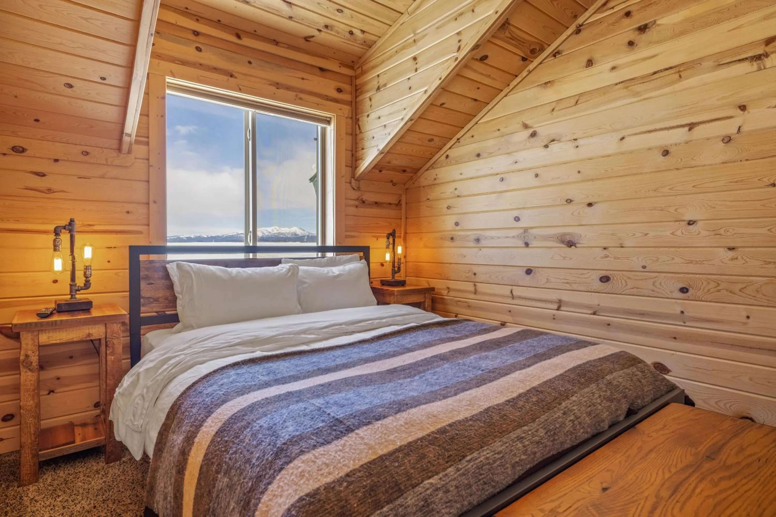 Bed in Liberty Lodge by KABINO Hot Tub Air Hockey 3 Living Rooms 7 bedrooms Boat Launch Reservoir ATV Snowmobile Trails WiFi