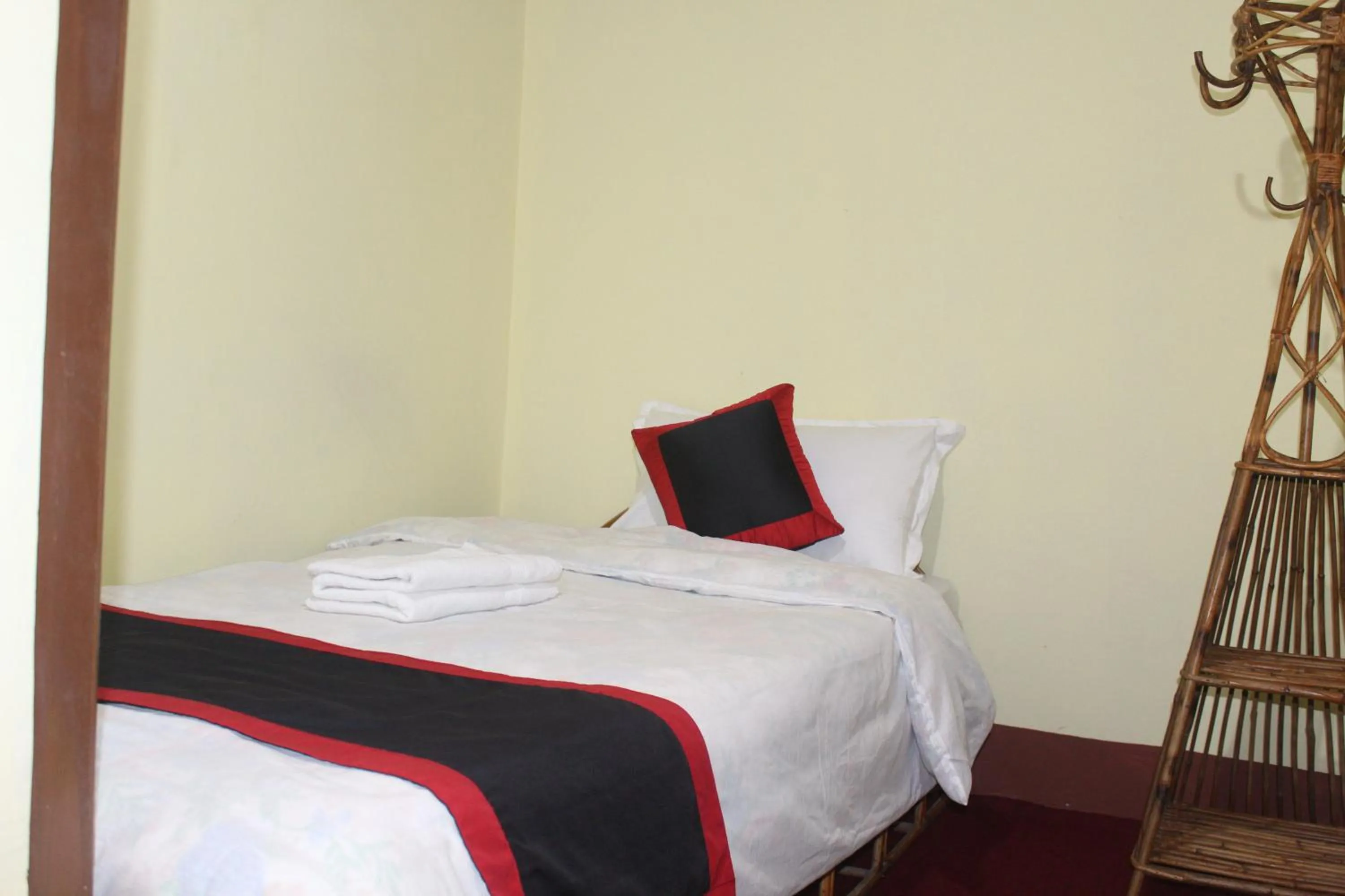 Bed in HOTEL RUPAKOT AND ROOFTOP RESTAURANT