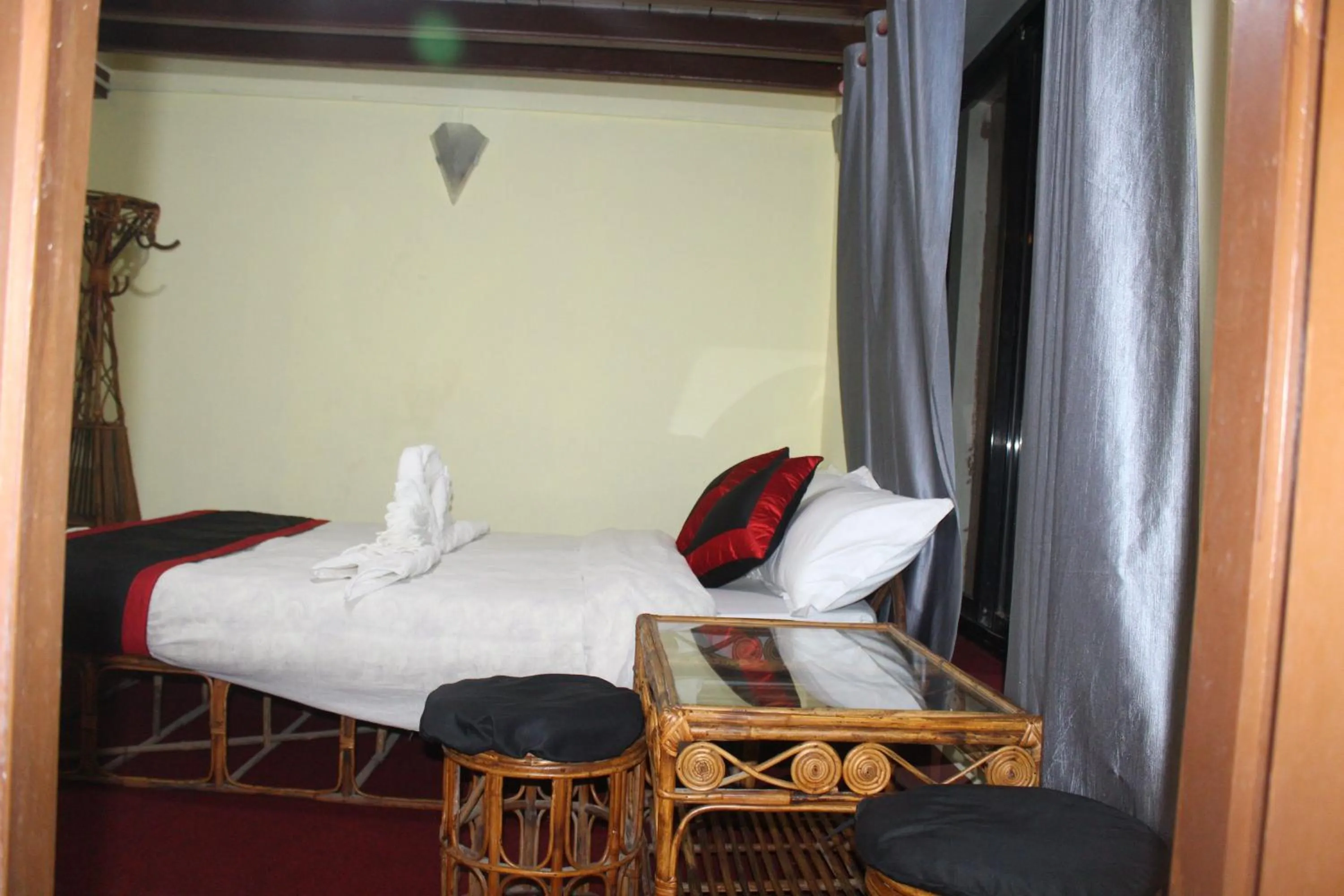 Bed in HOTEL RUPAKOT AND ROOFTOP RESTAURANT