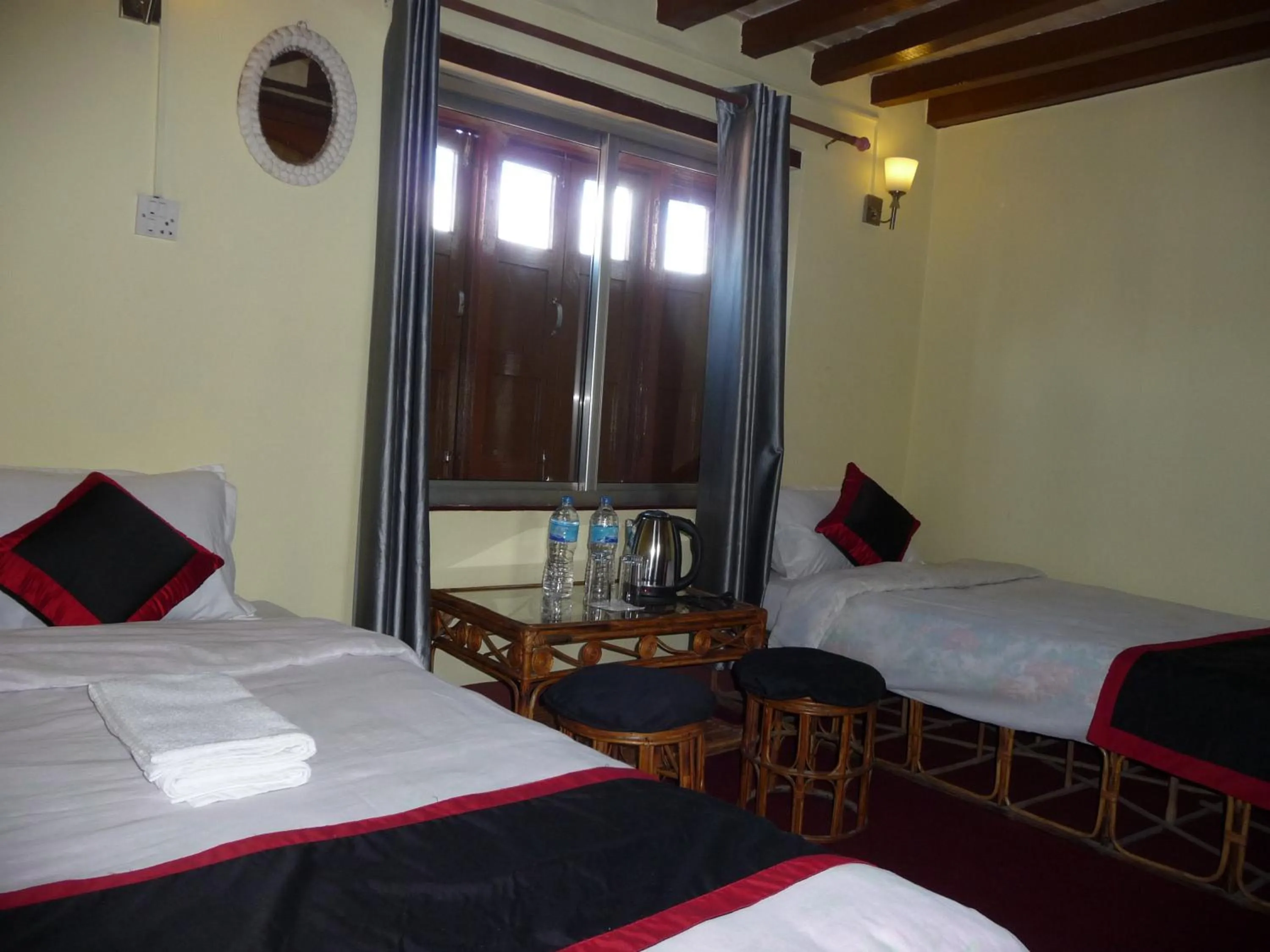 Bed in HOTEL RUPAKOT AND ROOFTOP RESTAURANT