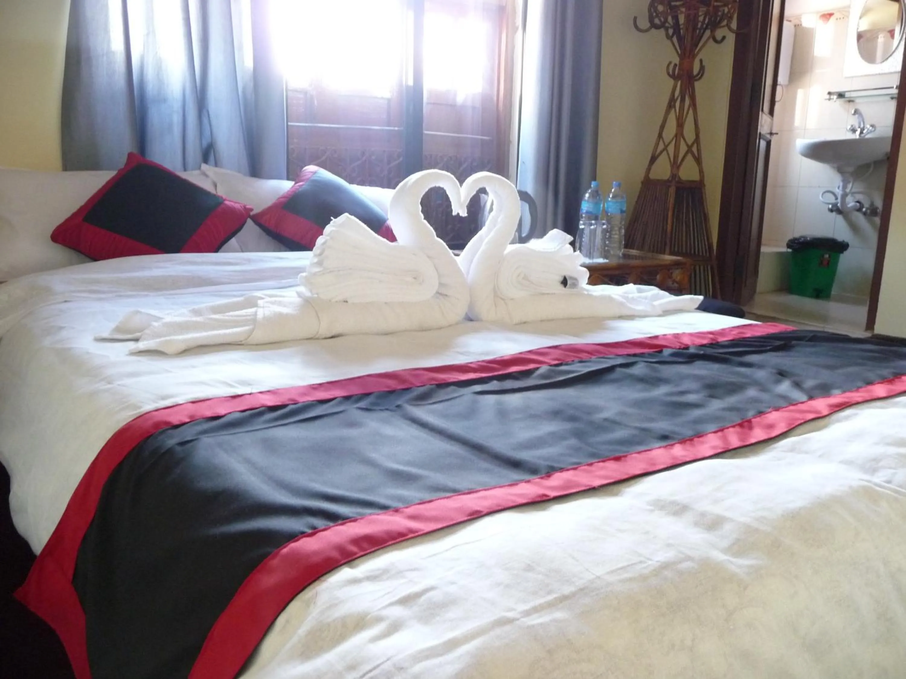 Bed in HOTEL RUPAKOT AND ROOFTOP RESTAURANT