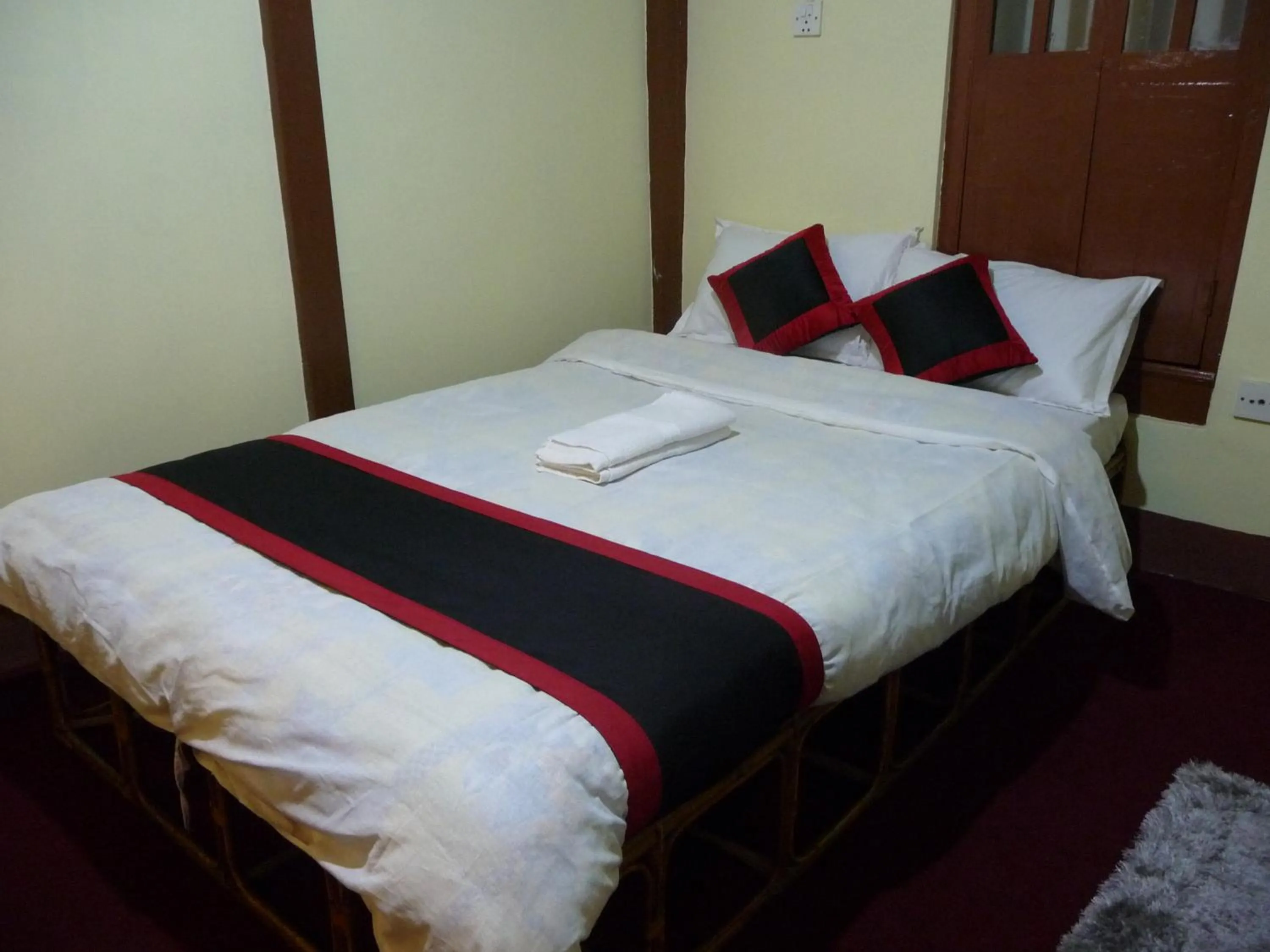 Bed in HOTEL RUPAKOT AND ROOFTOP RESTAURANT