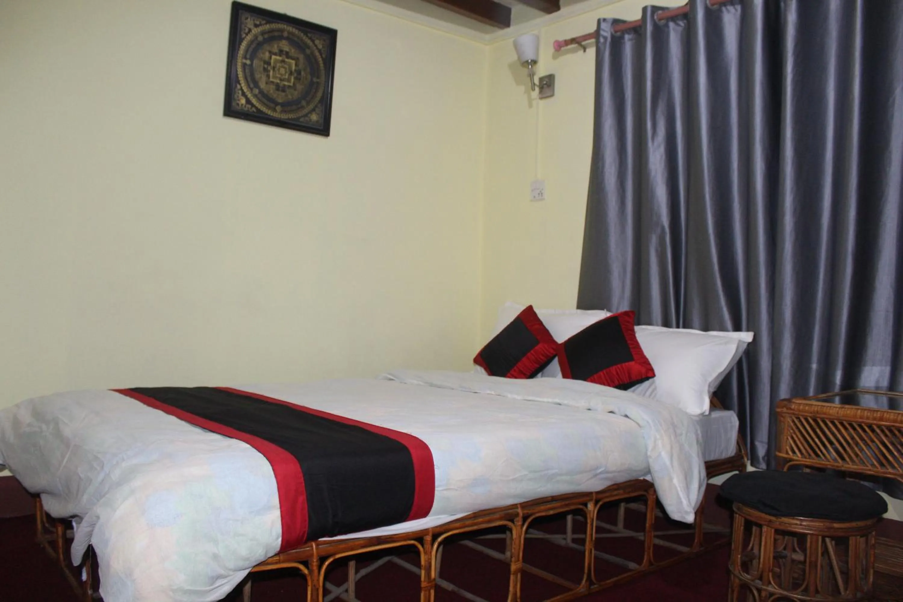Bed in HOTEL RUPAKOT AND ROOFTOP RESTAURANT