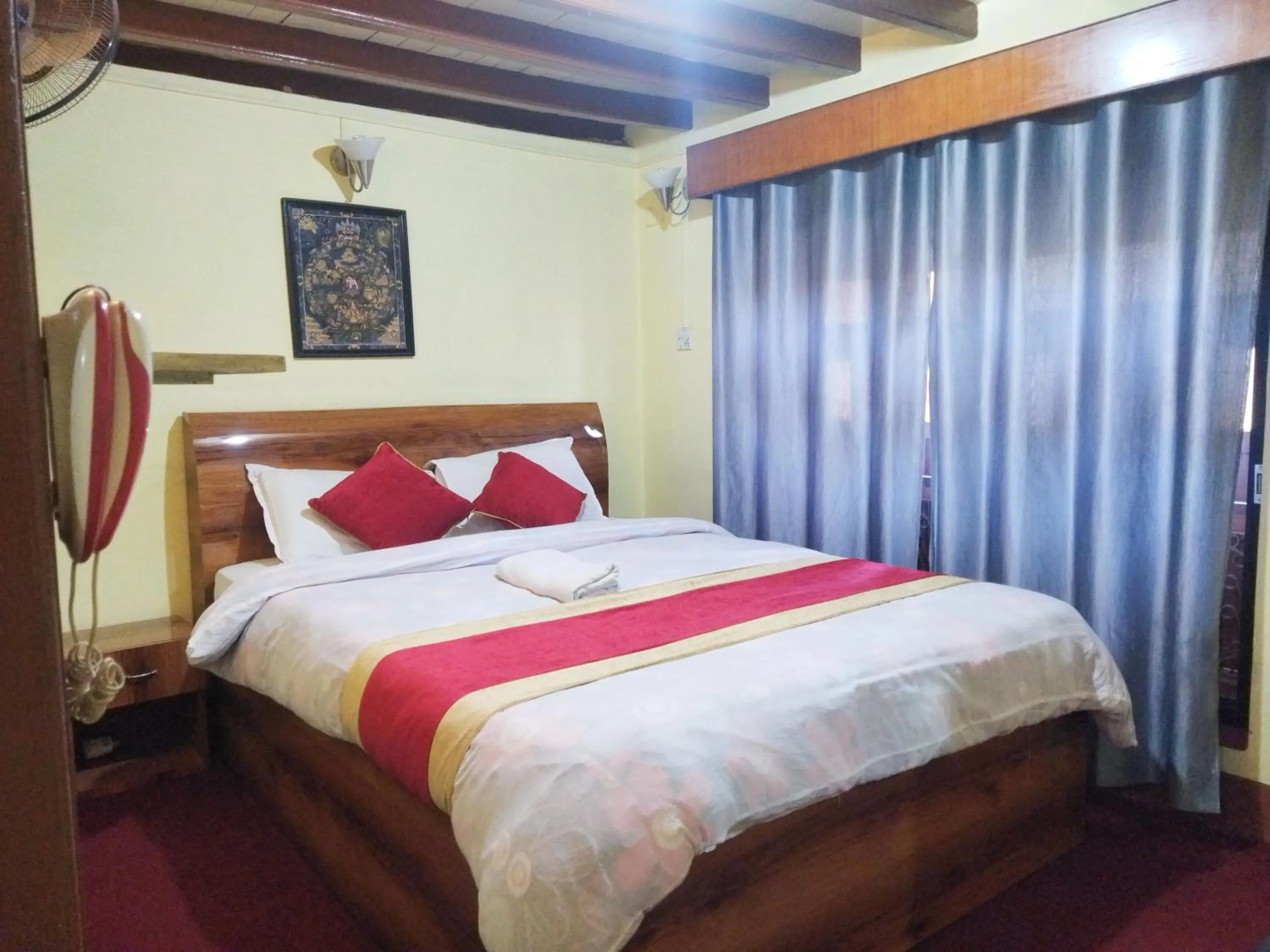 Bed in HOTEL RUPAKOT AND ROOFTOP RESTAURANT