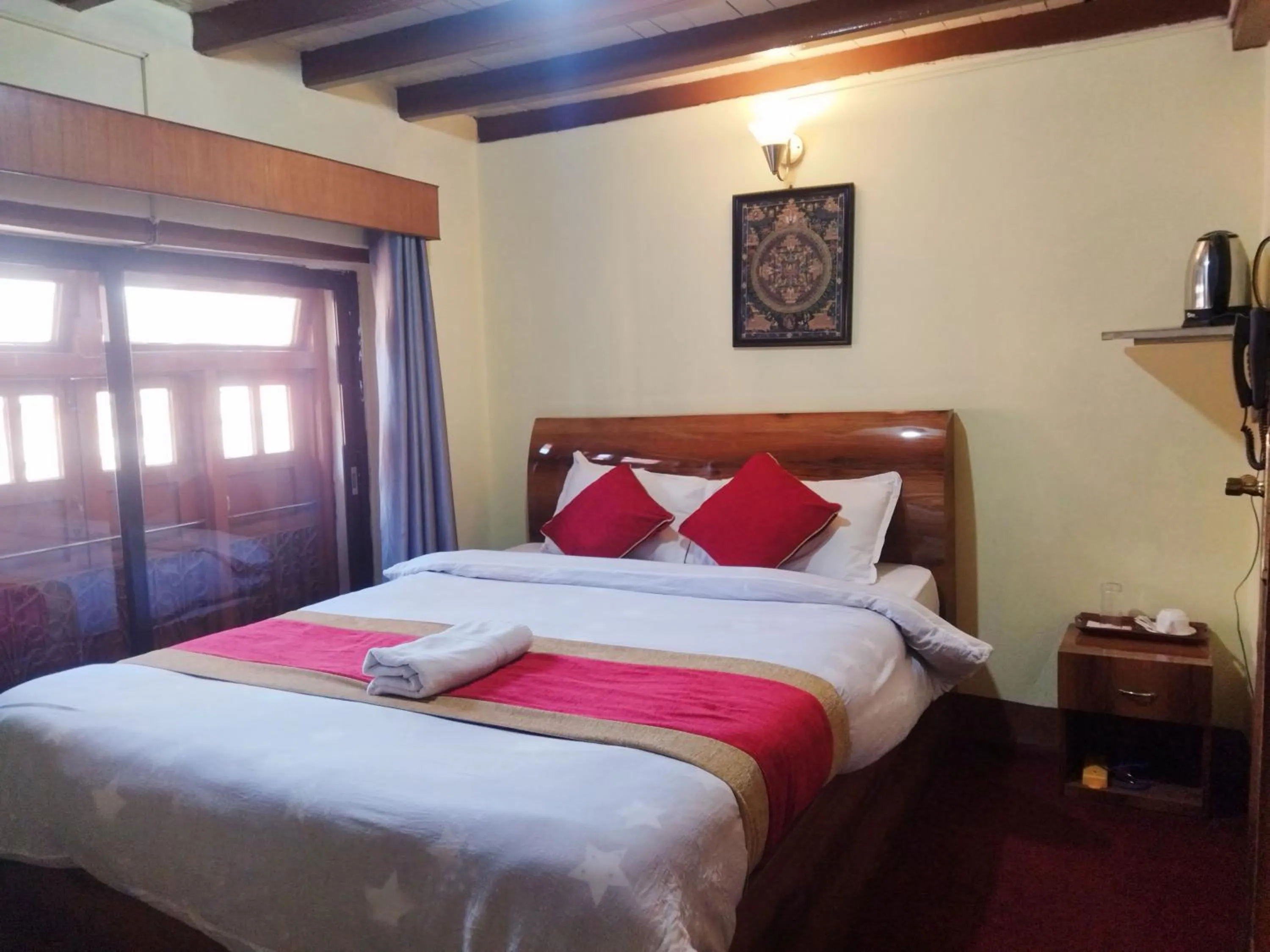 Bed in HOTEL RUPAKOT AND ROOFTOP RESTAURANT