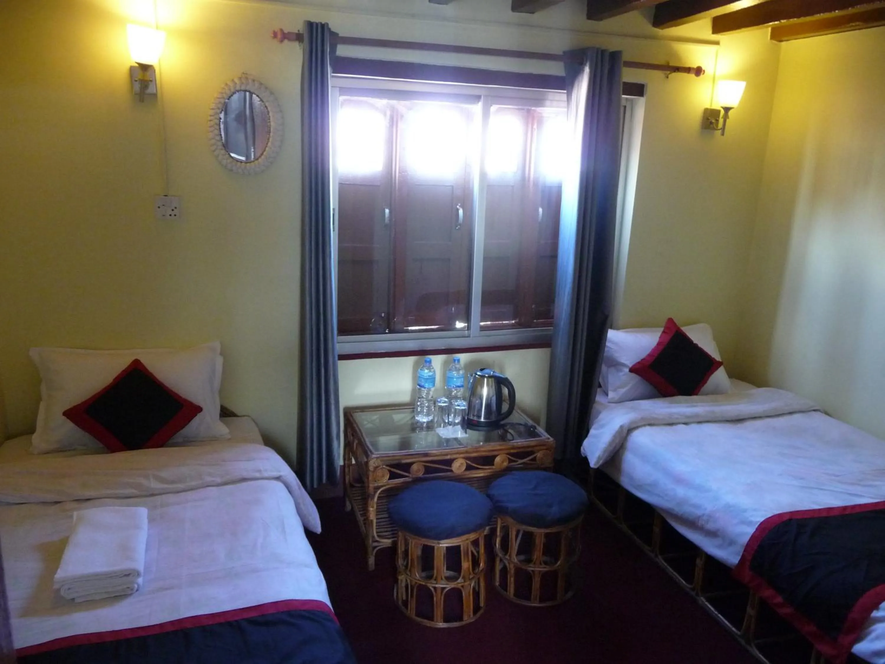 Bed in HOTEL RUPAKOT AND ROOFTOP RESTAURANT