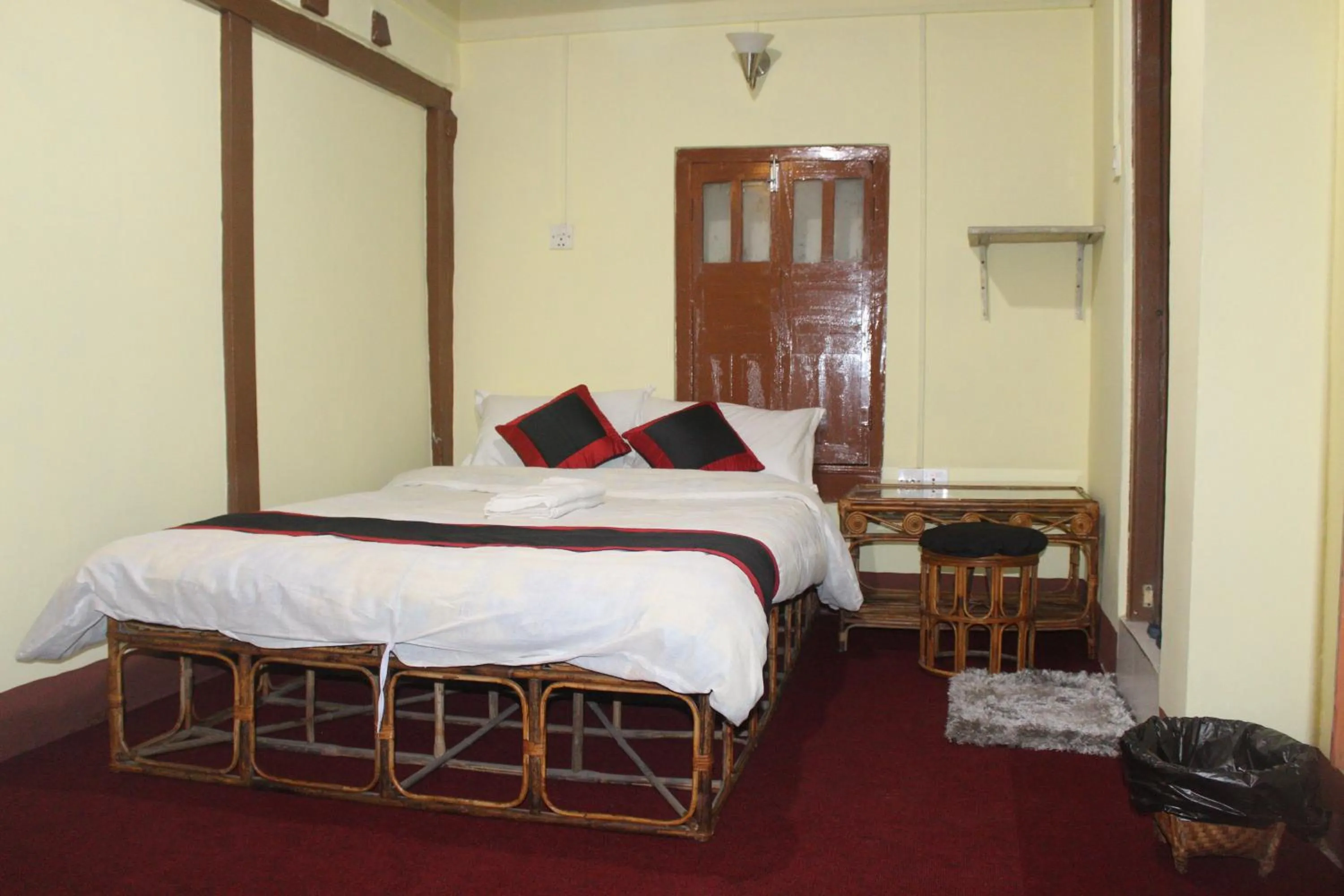 Bed in HOTEL RUPAKOT AND ROOFTOP RESTAURANT
