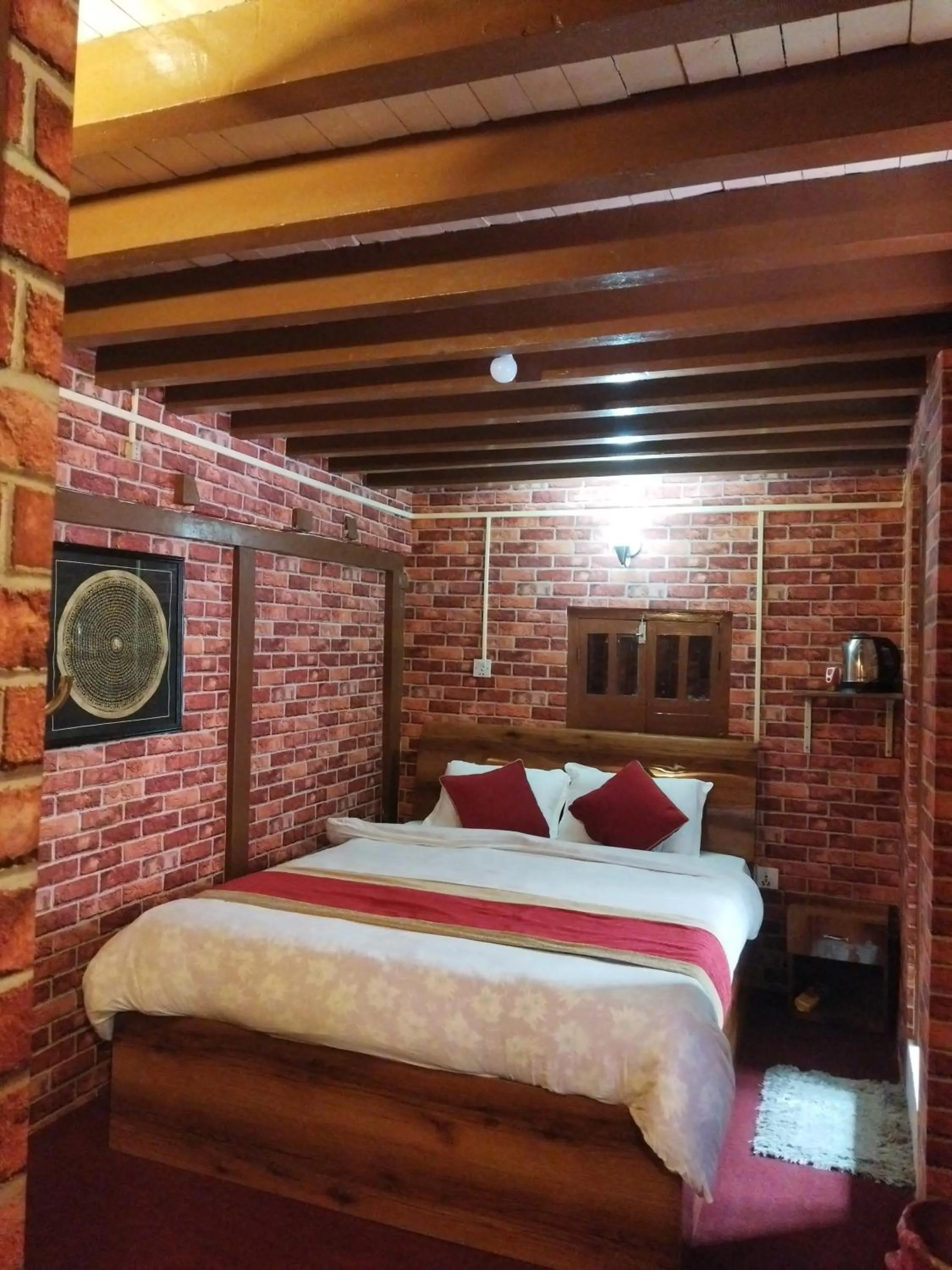 Bed in HOTEL RUPAKOT AND ROOFTOP RESTAURANT