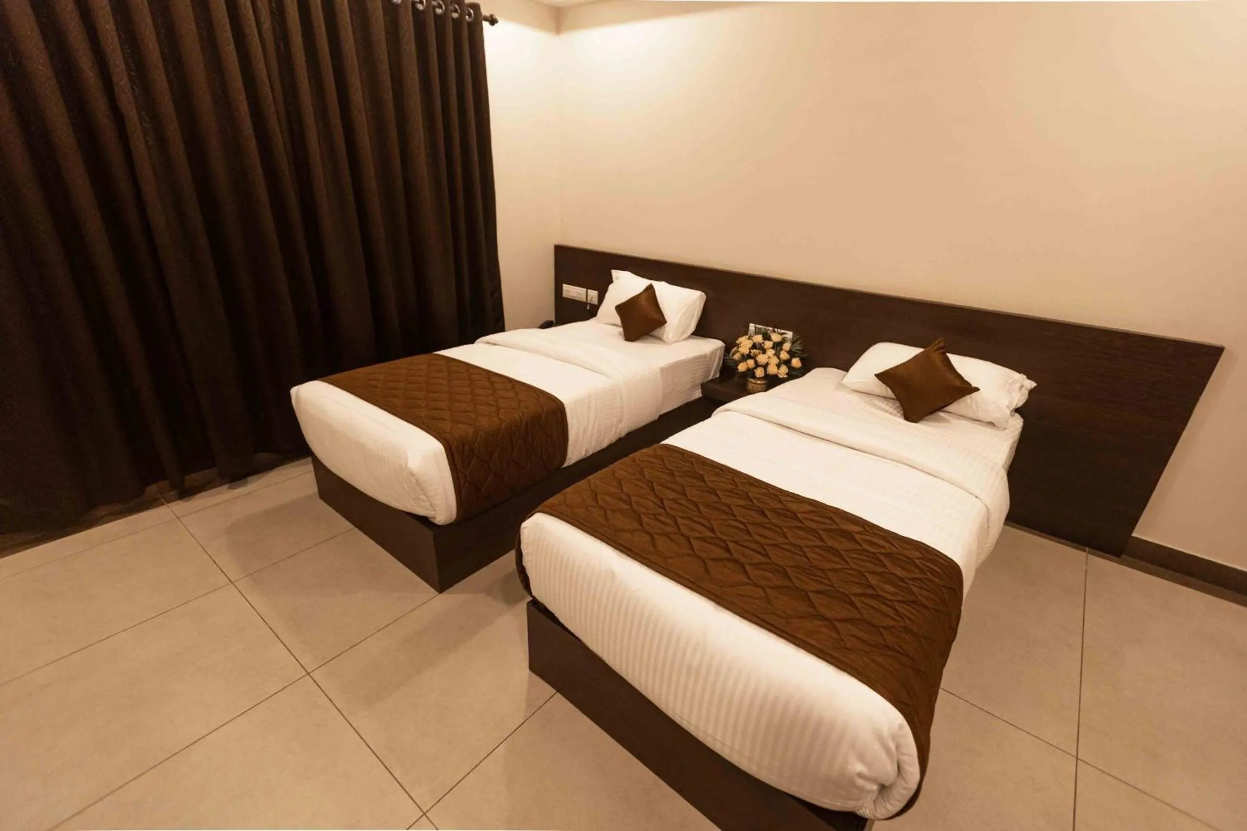 Bed in HOTEL PANKAJ RESIDENCY