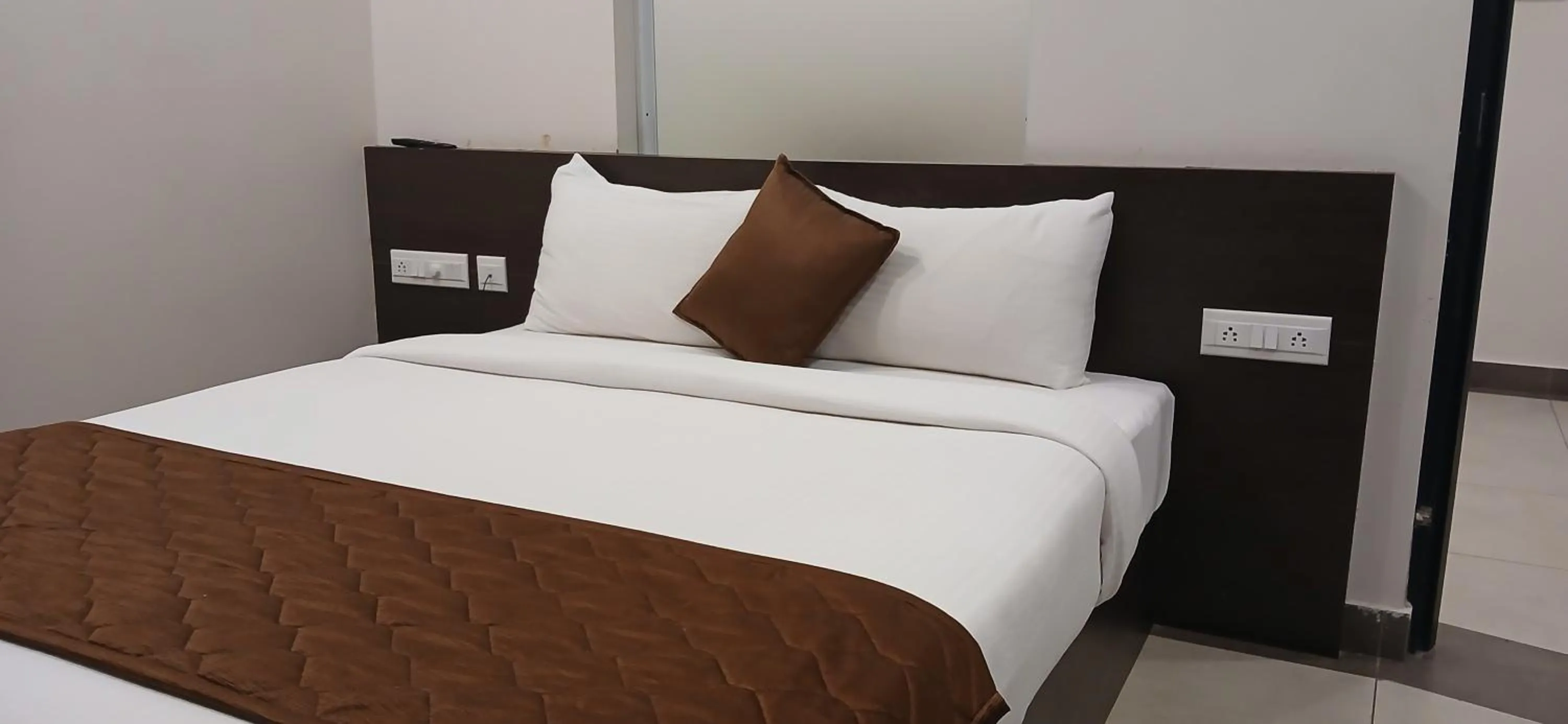 Bed in HOTEL PANKAJ RESIDENCY