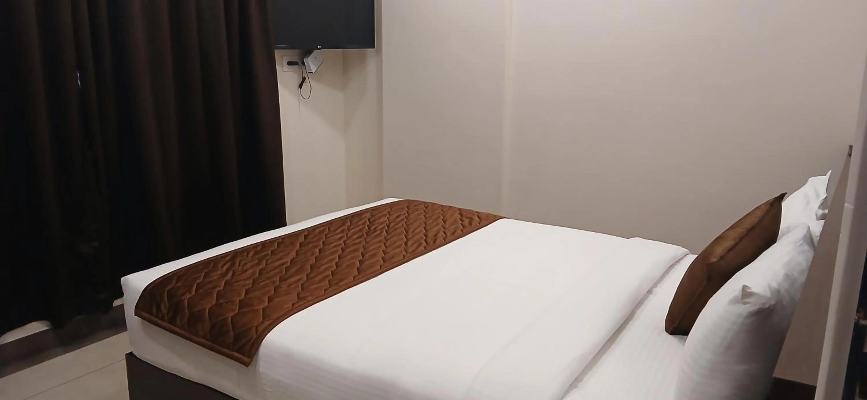 Bed in HOTEL PANKAJ RESIDENCY