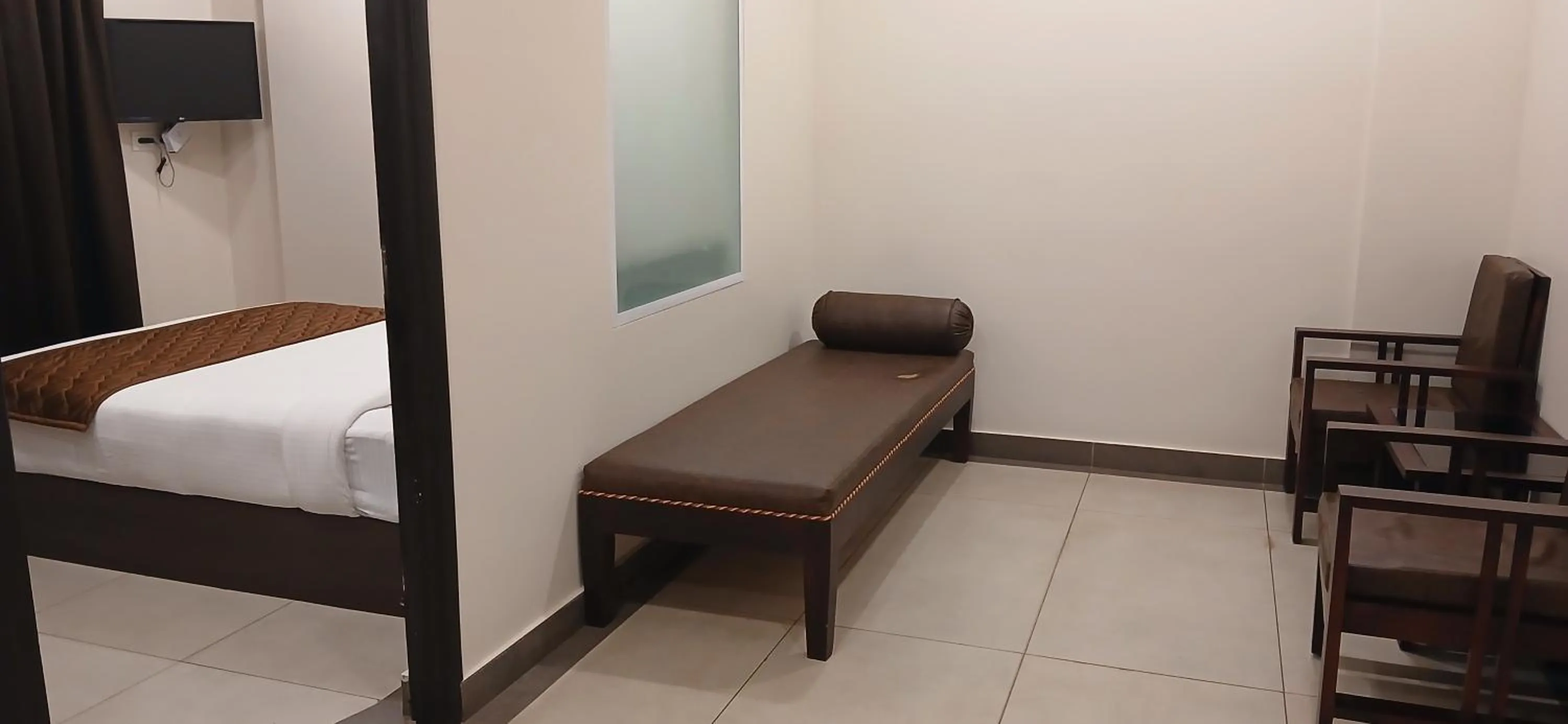 Seating area, Bed in HOTEL PANKAJ RESIDENCY