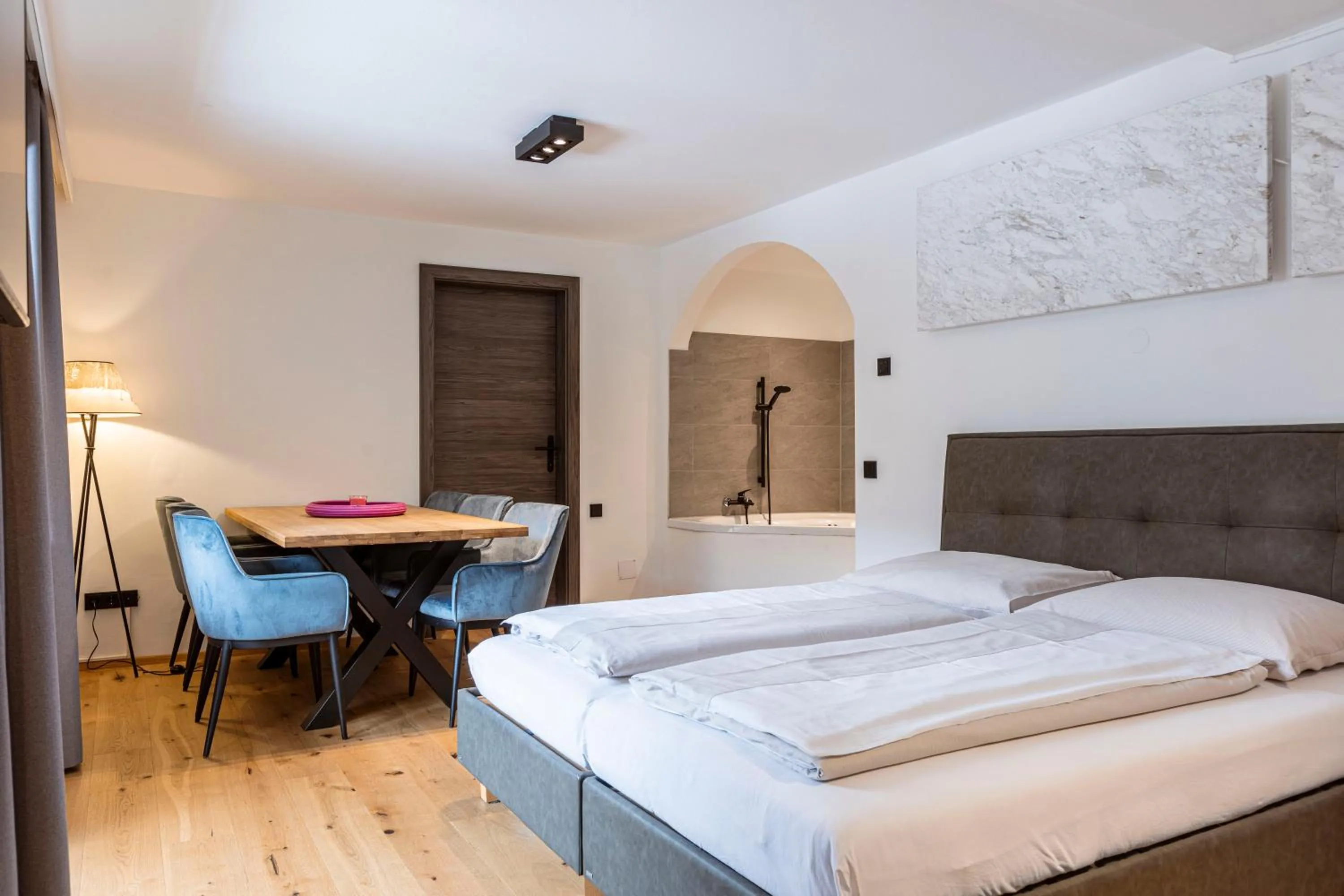 Living room, Bed in Saalbach Suites by ALPS RESORTS