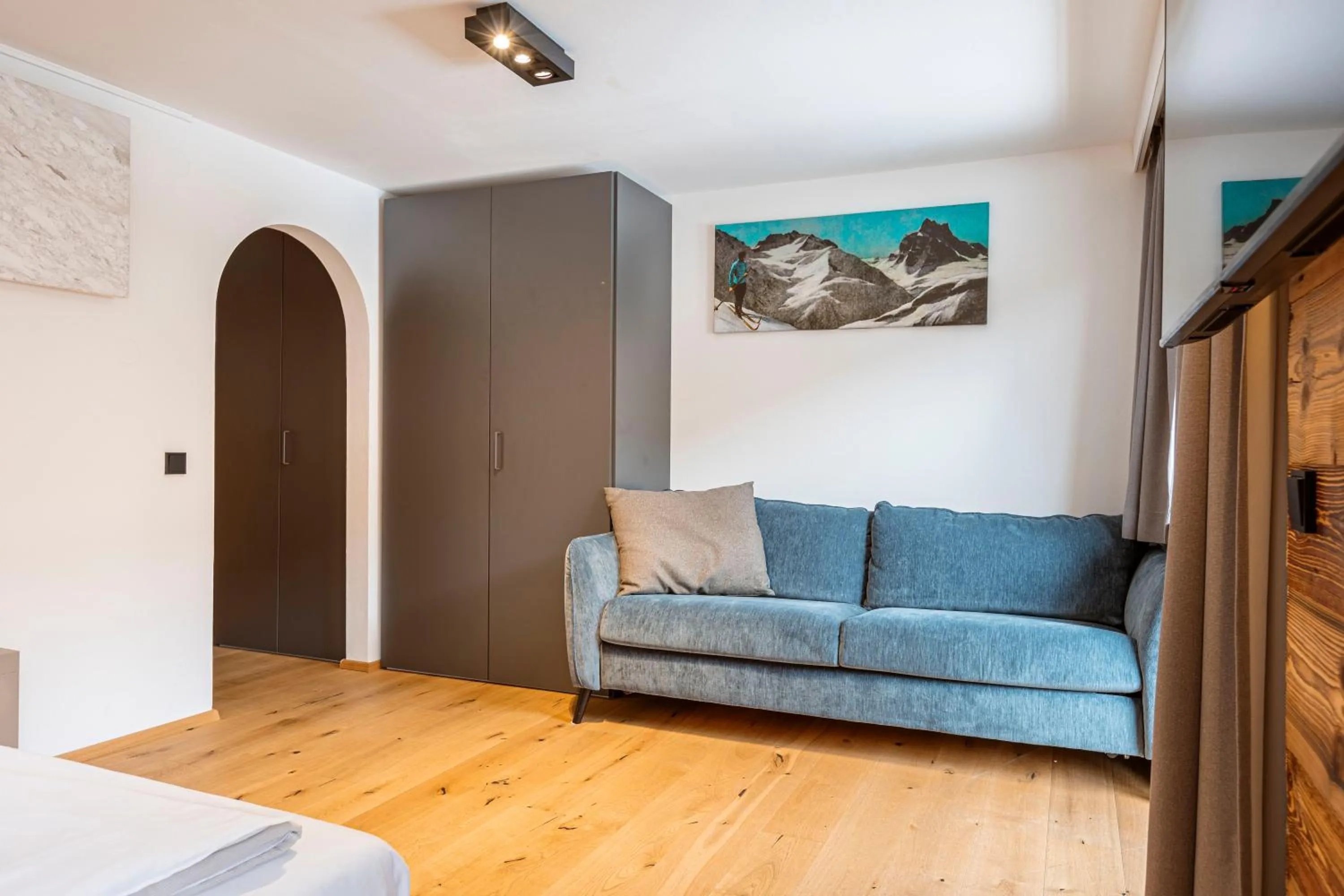 Living room, Bed in Saalbach Suites by ALPS RESORTS