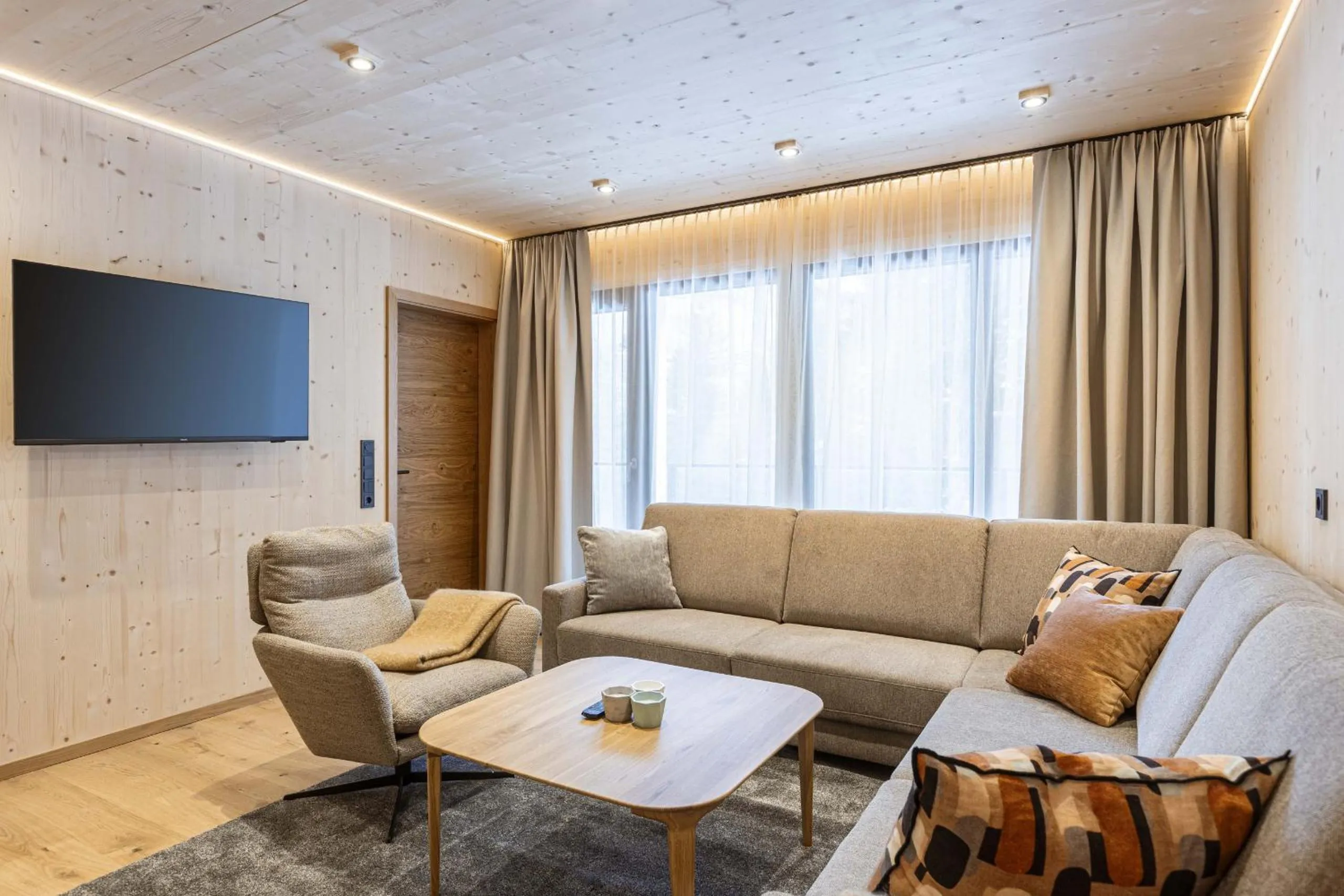 Living room in Saalbach Suites by ALPS RESORTS