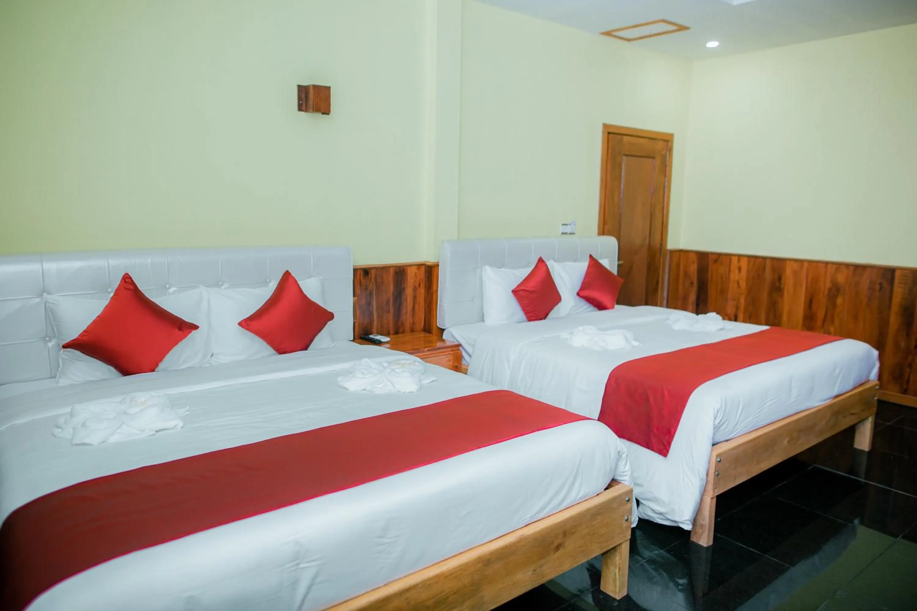 Photo of the whole room, Bed in Mohasal Angkor Boutique