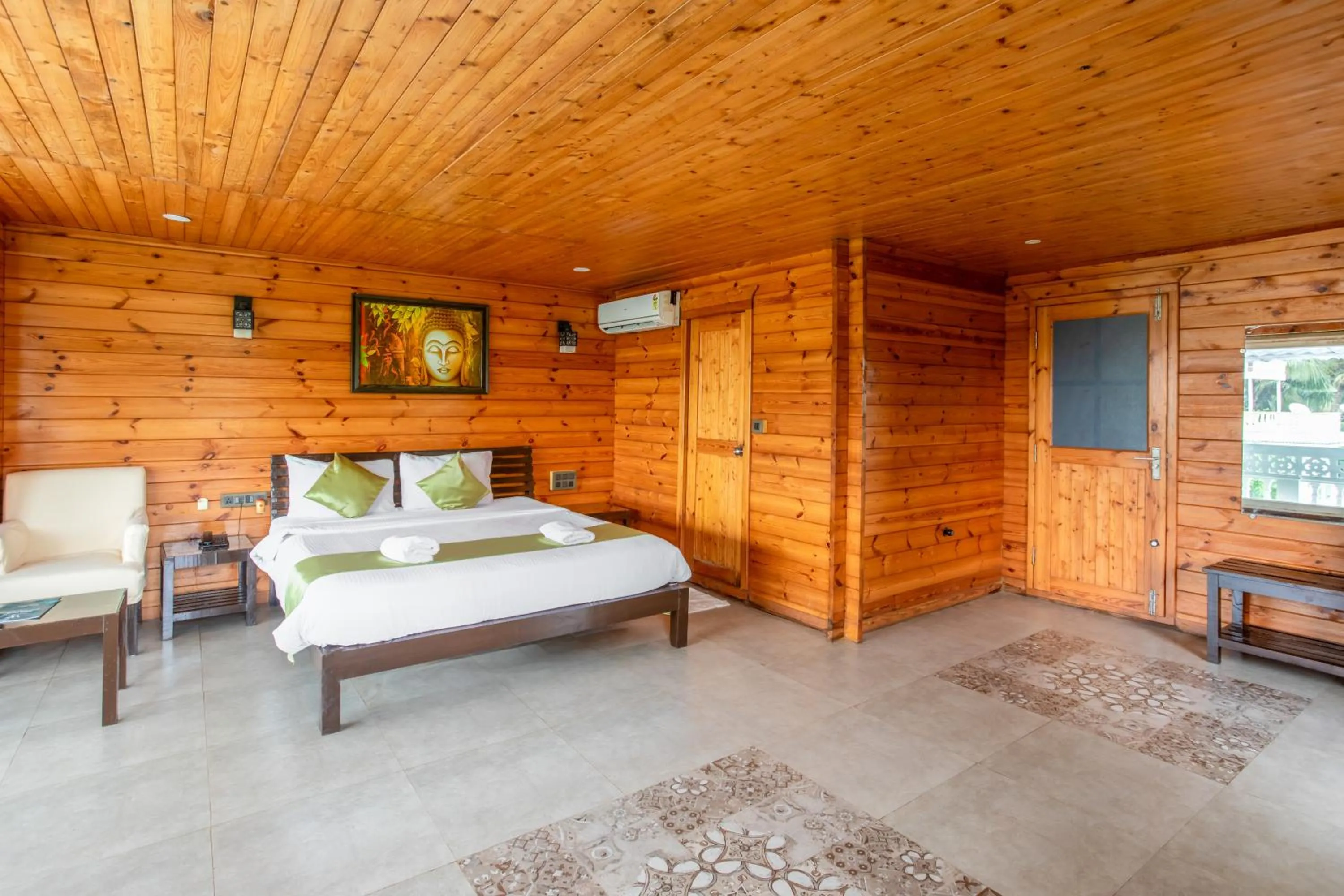 Bed in Stone Wood Riverfront Resort, Siolim