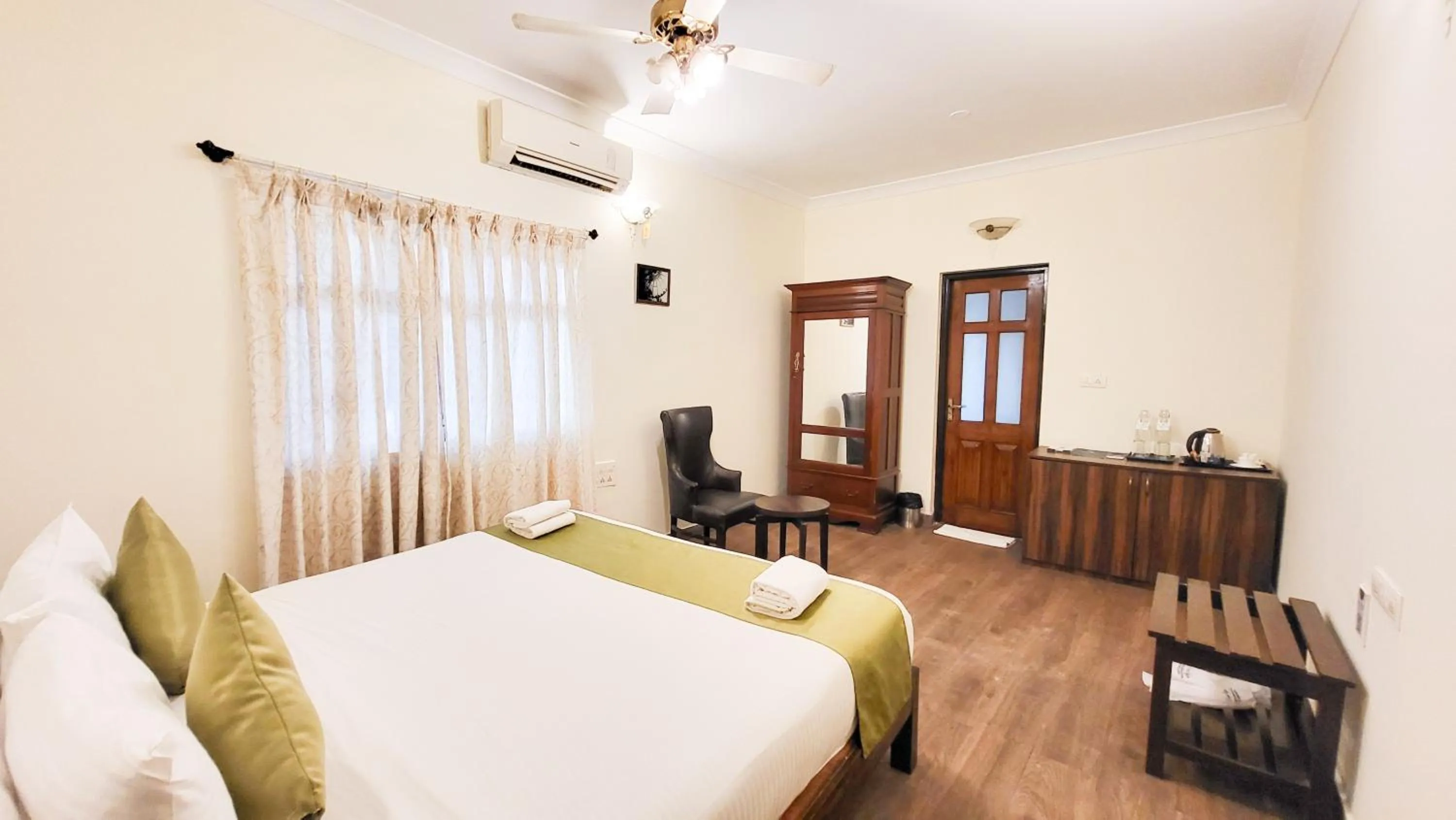 Bed in Stone Wood Riverfront Resort, Siolim