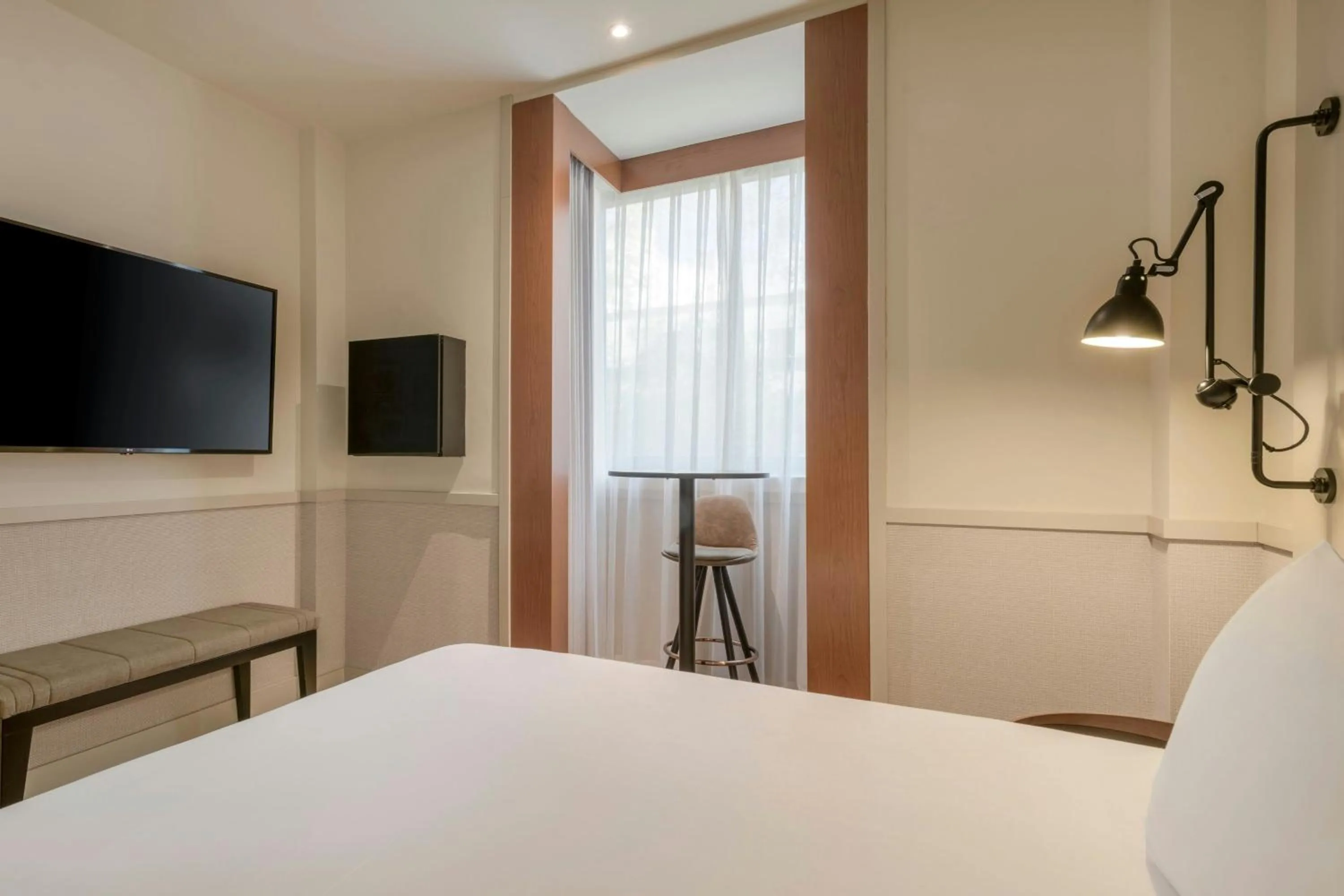 Photo of the whole room, Bed in AC Hotel Los Vascos by Marriott