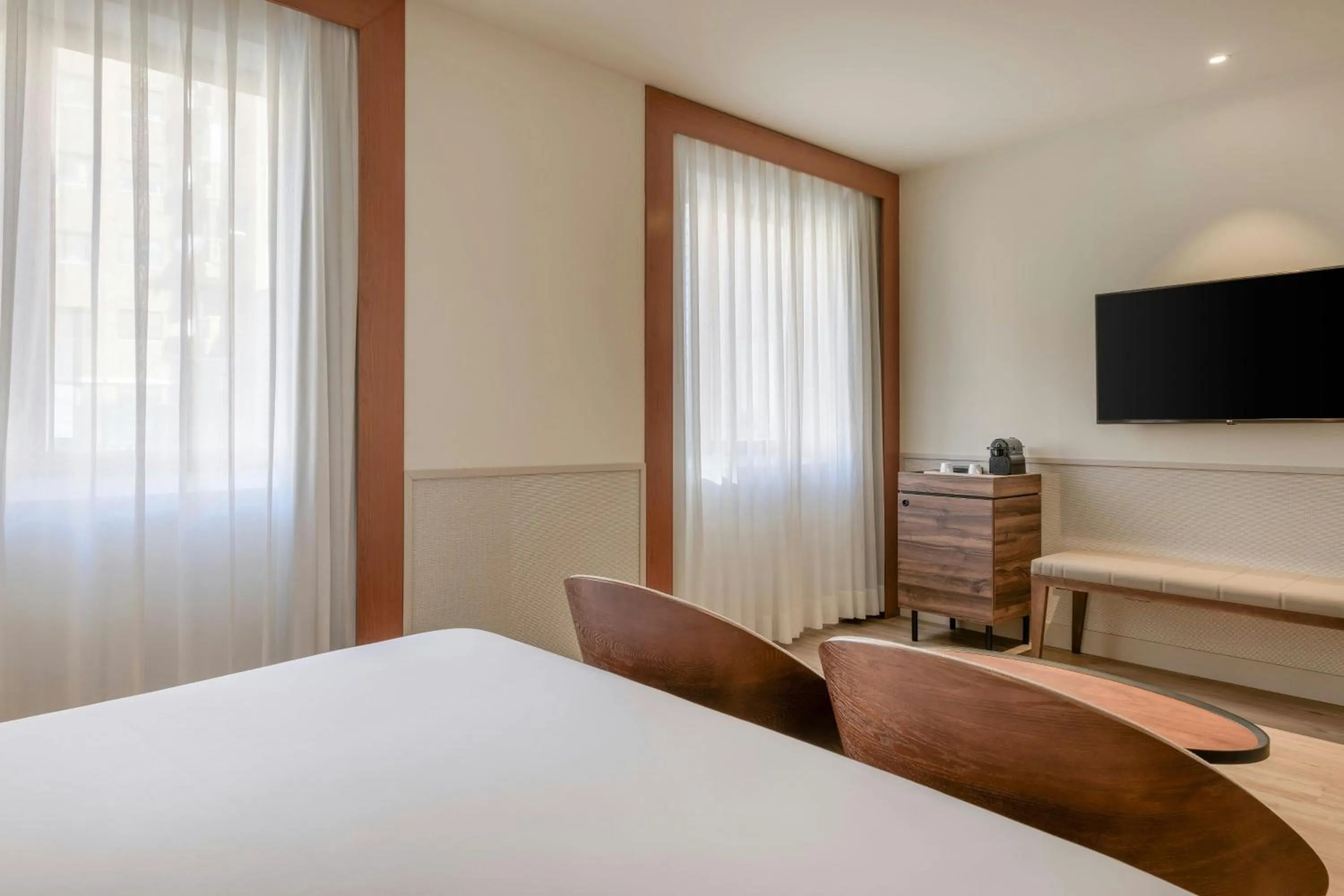 Photo of the whole room, Bed in AC Hotel Los Vascos by Marriott