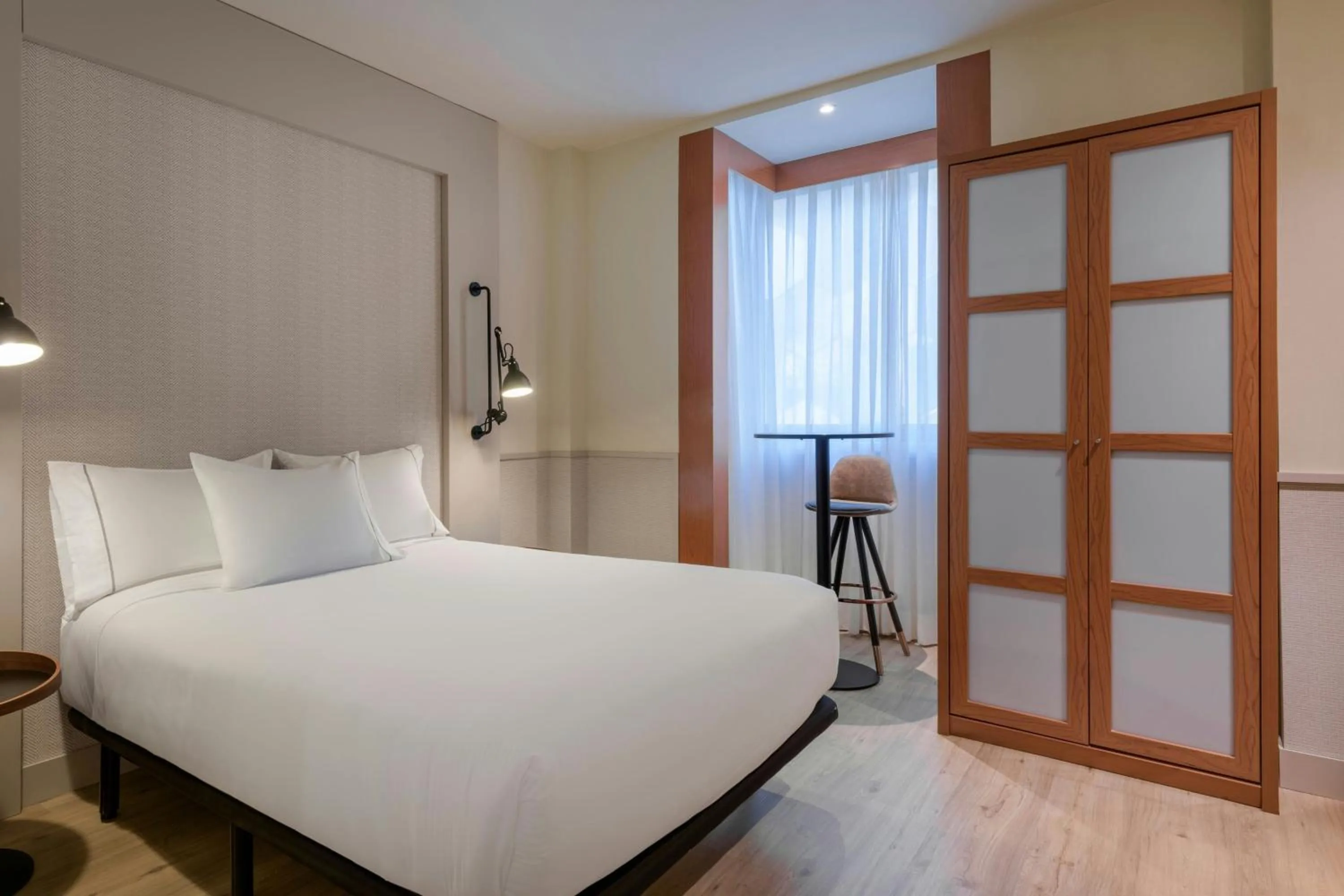 Photo of the whole room, Bed in AC Hotel Los Vascos by Marriott