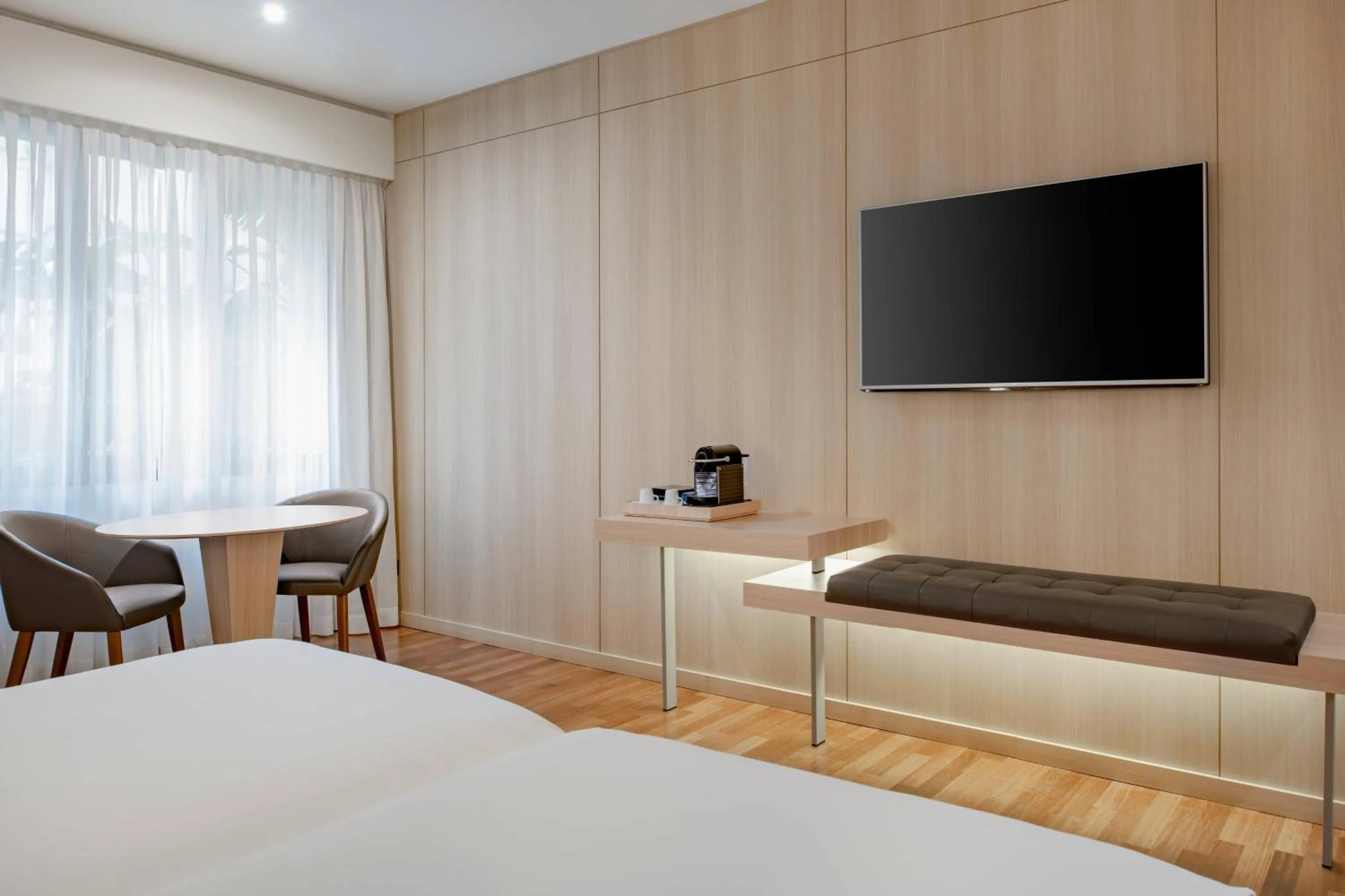 Photo of the whole room, Bed in AC Hotel Málaga Palacio by Marriott