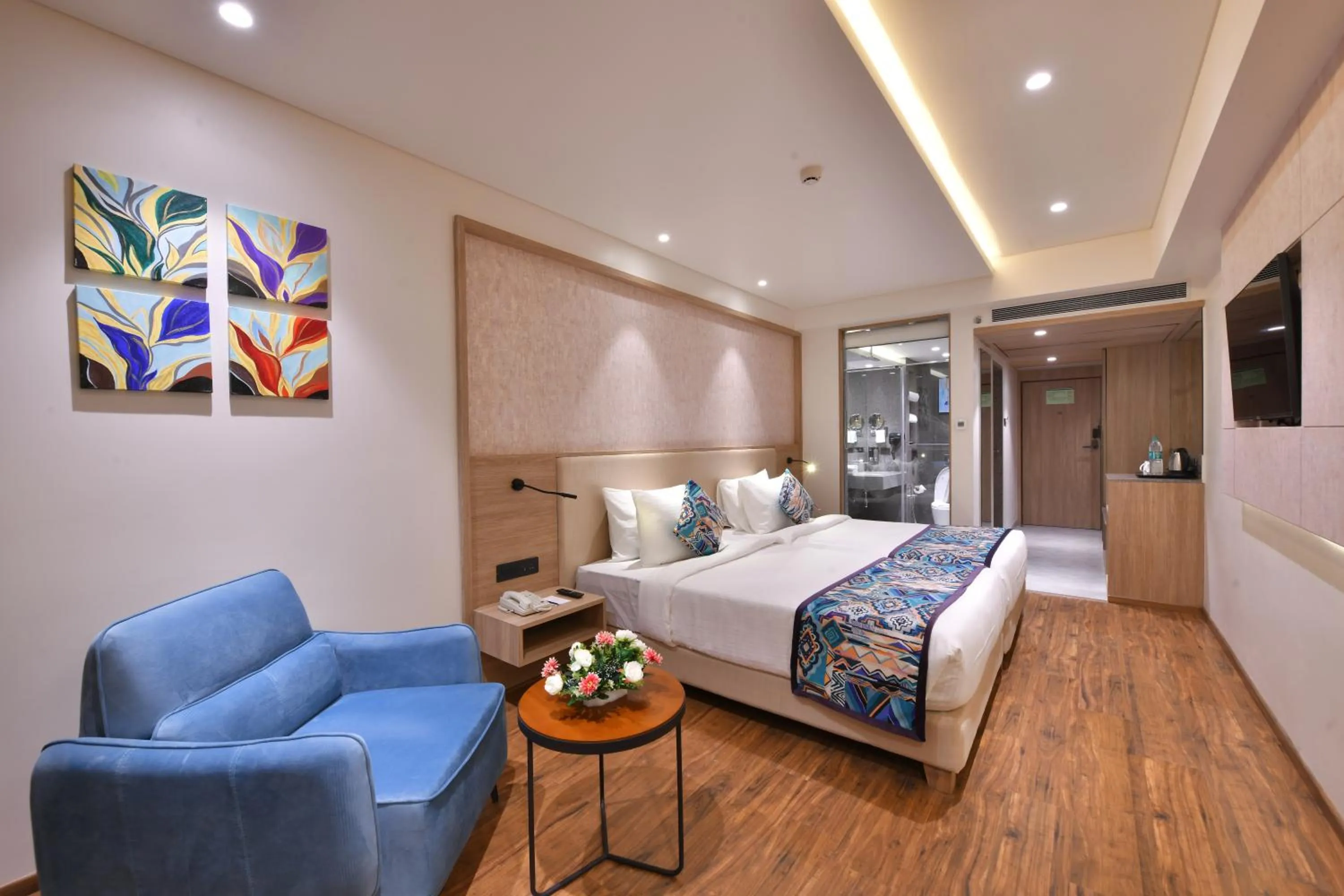 Seating area, Bed in Regenta Fairlark Vadodara